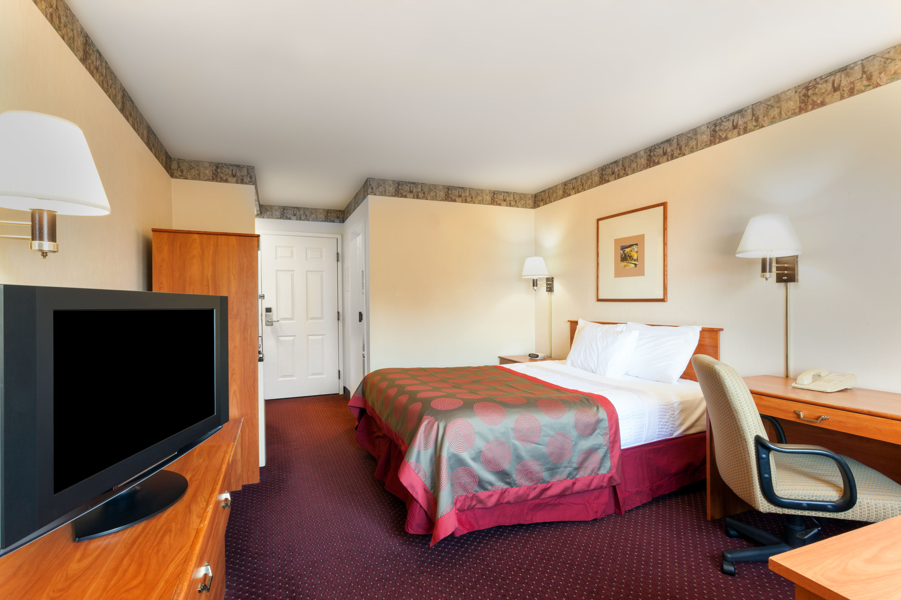 Guest room at the Ramada by Wyndham SeaTac Airport North in Tukwila, Washington