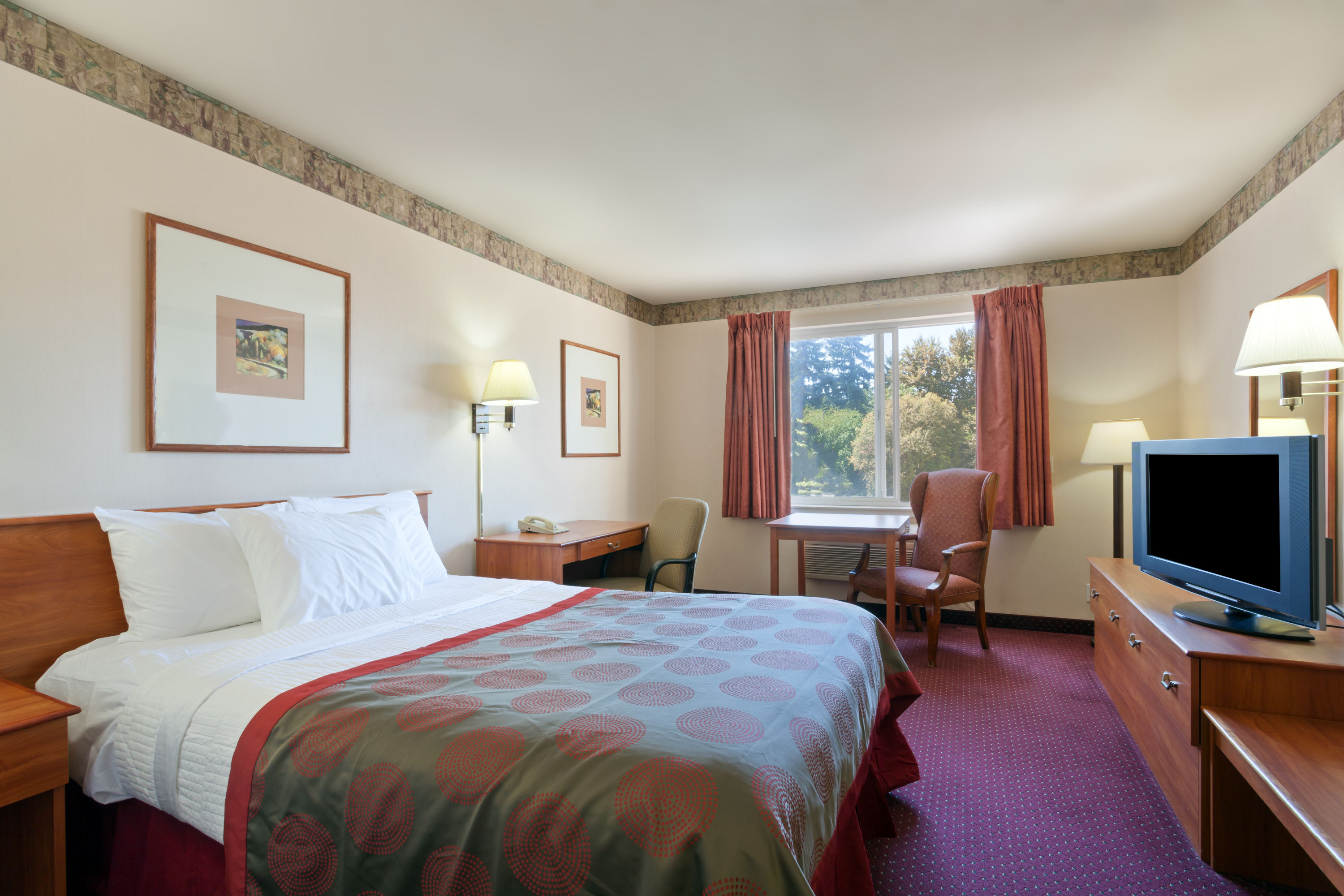 Guest room at the Ramada by Wyndham SeaTac Airport North in Tukwila, Washington