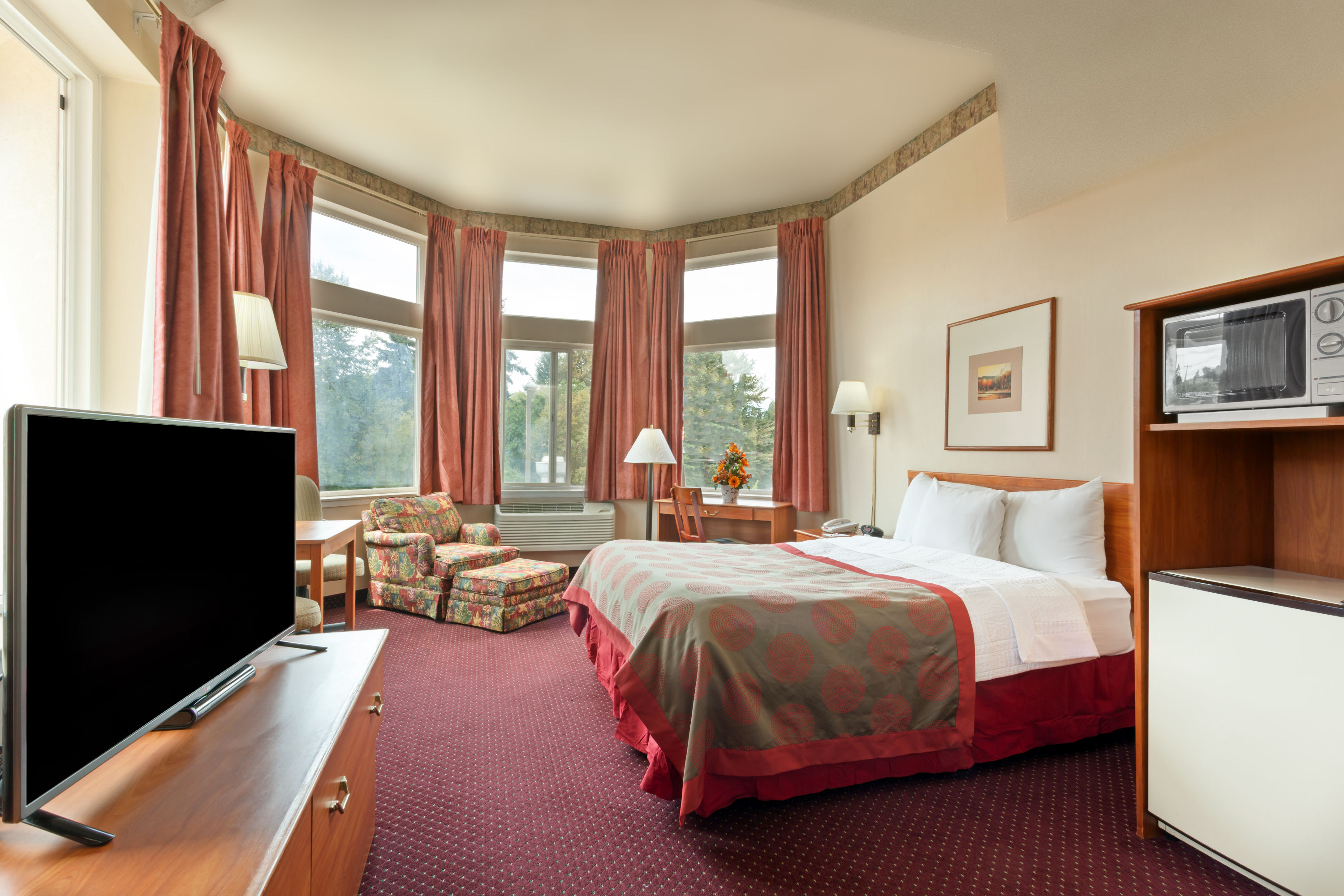 Guest room at the Ramada by Wyndham SeaTac Airport North in Tukwila, Washington