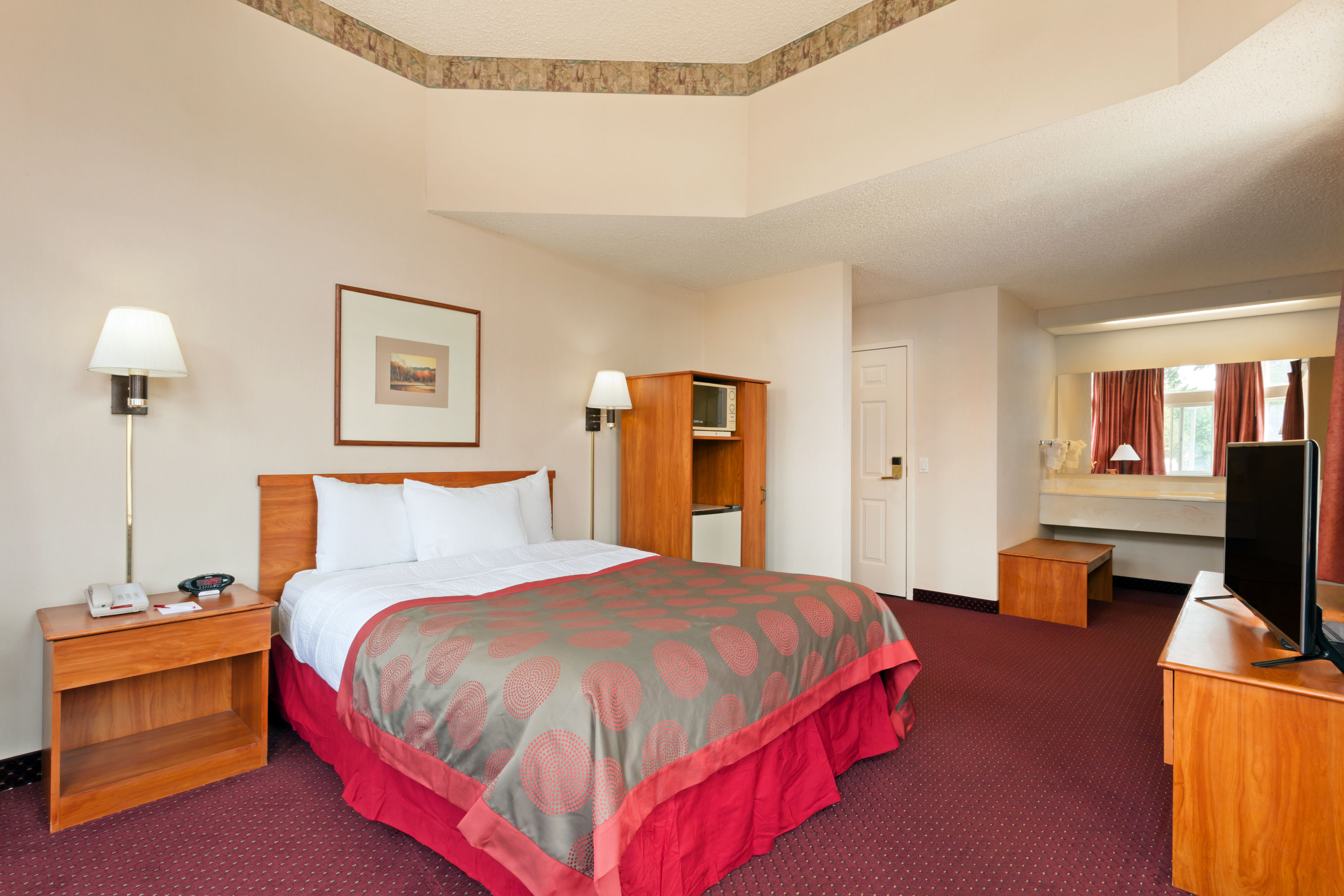 Guest room at the Ramada by Wyndham SeaTac Airport North in Tukwila, Washington