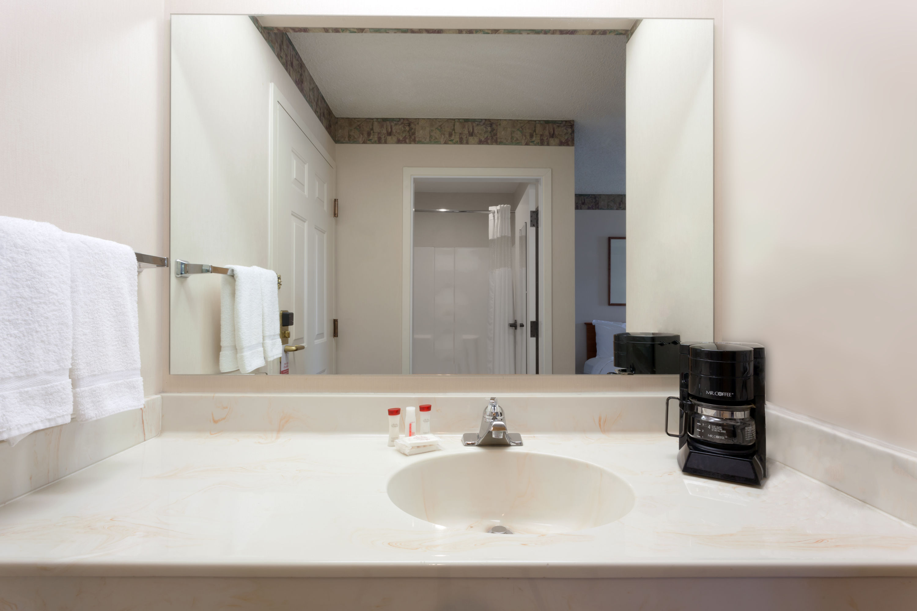 Guest room at the Ramada by Wyndham SeaTac Airport North in Tukwila, Washington