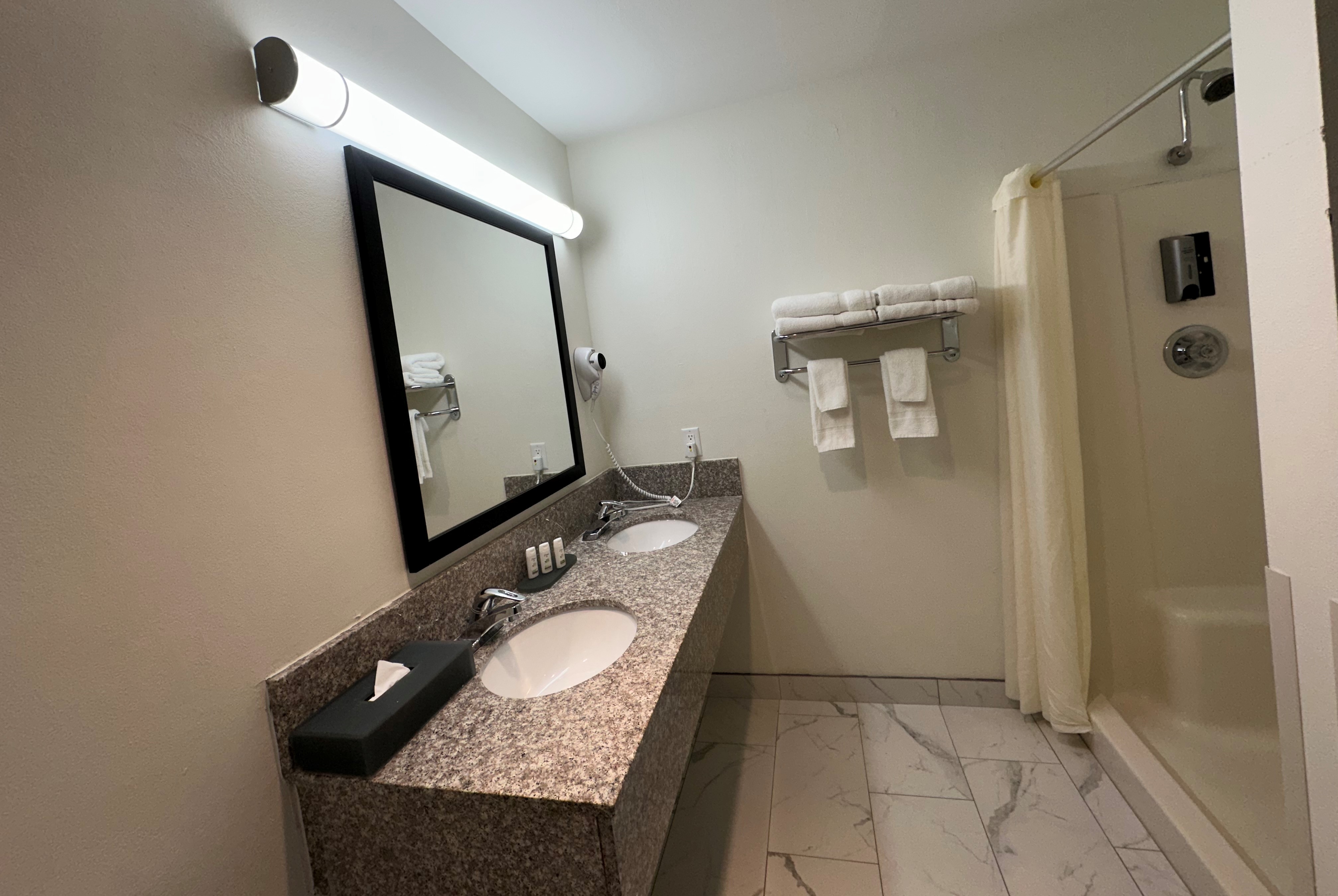 Guest room bath at the Ramada by Wyndham Waupaca in Waupaca, Wisconsin