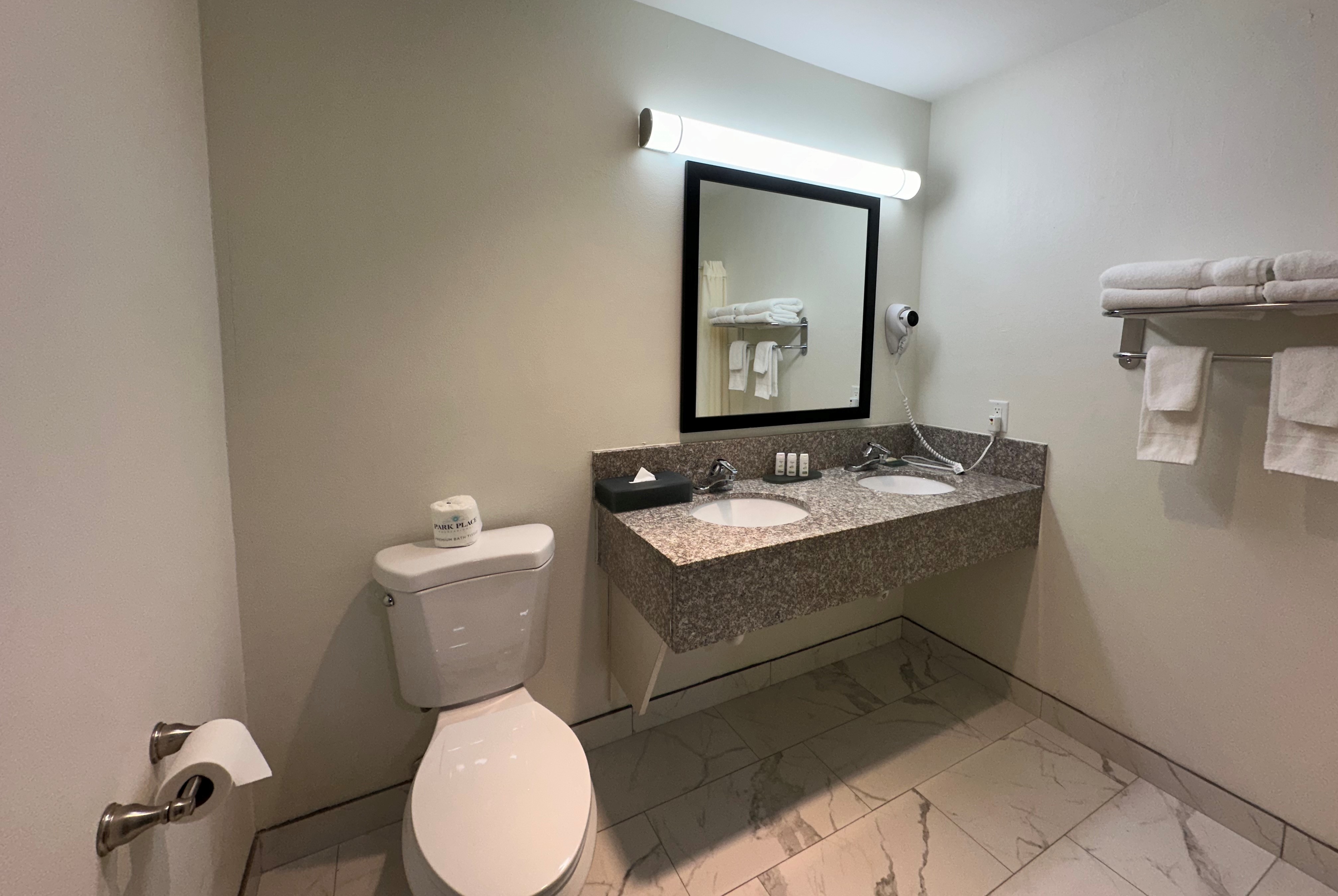 Guest room bath at the Ramada by Wyndham Waupaca in Waupaca, Wisconsin