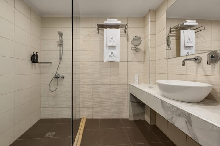 Guest room bath at the Ajul Luxury Hotel & Spa Resort, A Registry Collection Hotel in Agia Paraskevi Chalikidi, Other than US/Canada