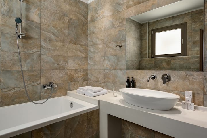 Guest room bath at the Ajul Luxury Hotel & Spa Resort, A Registry Collection Hotel in Agia Paraskevi Chalikidi, Other than US/Canada