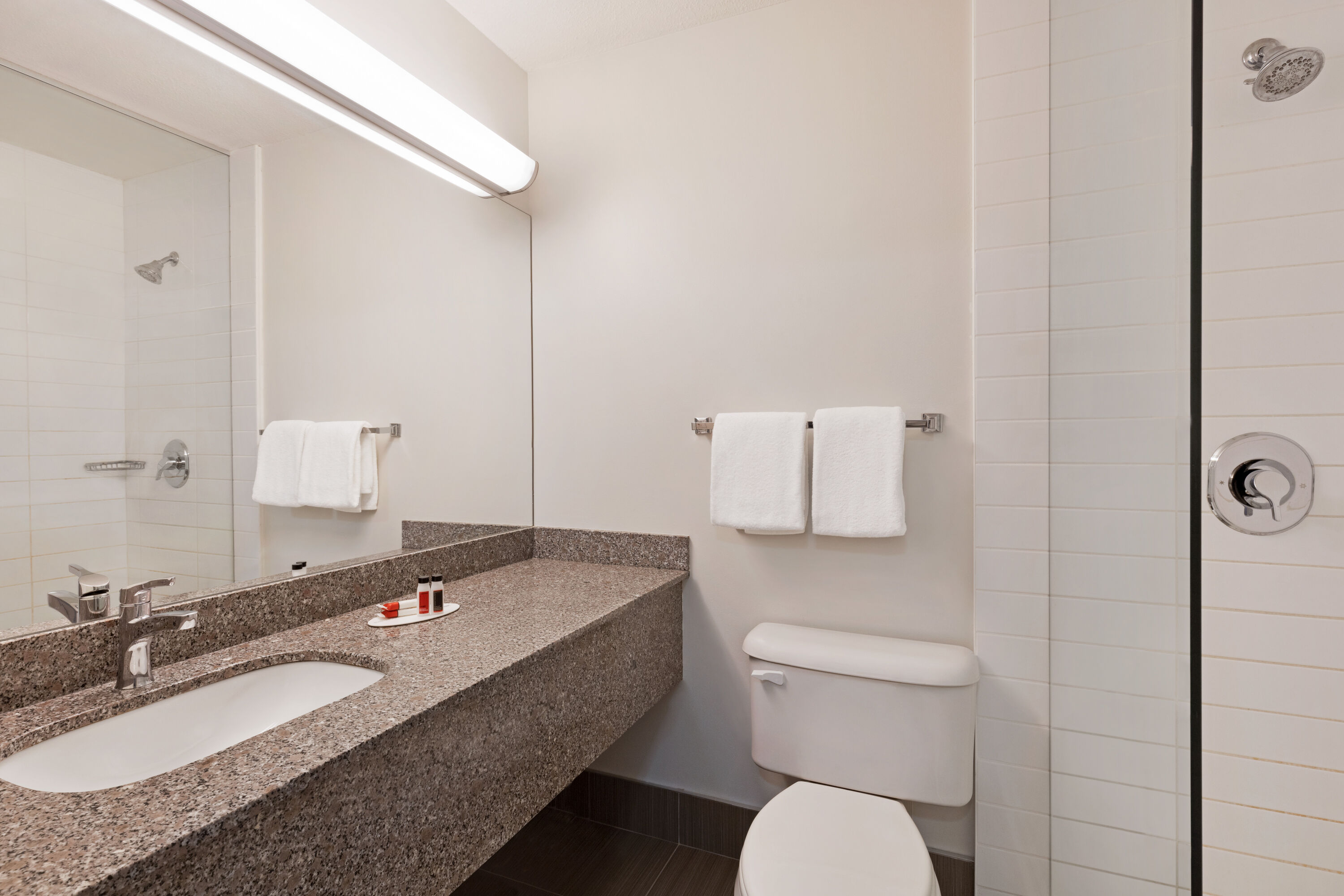 Guest room bath at the Super 8 by Wyndham Calgary Shawnessy Area in Calgary, Alberta