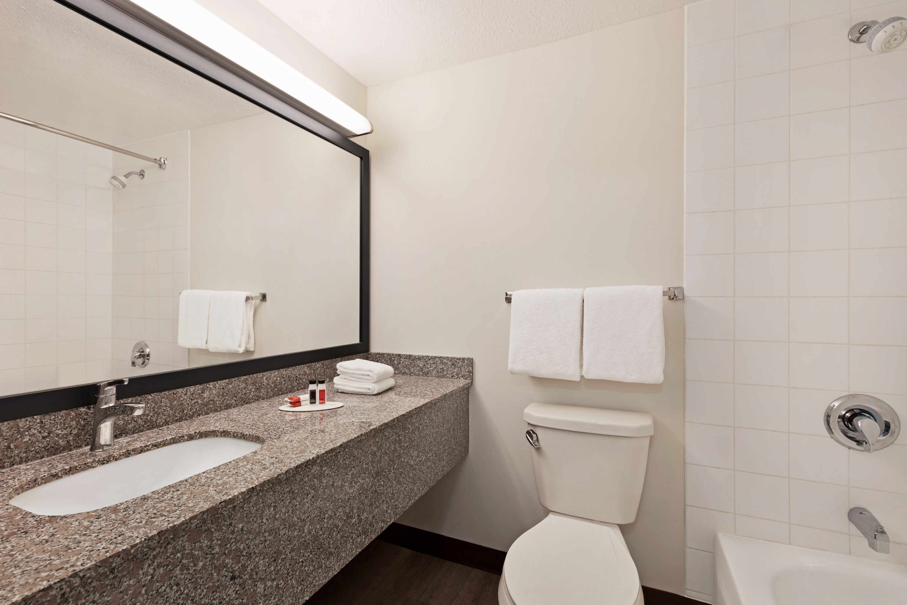 Guest room bath at the Super 8 by Wyndham Calgary Shawnessy Area in Calgary, Alberta