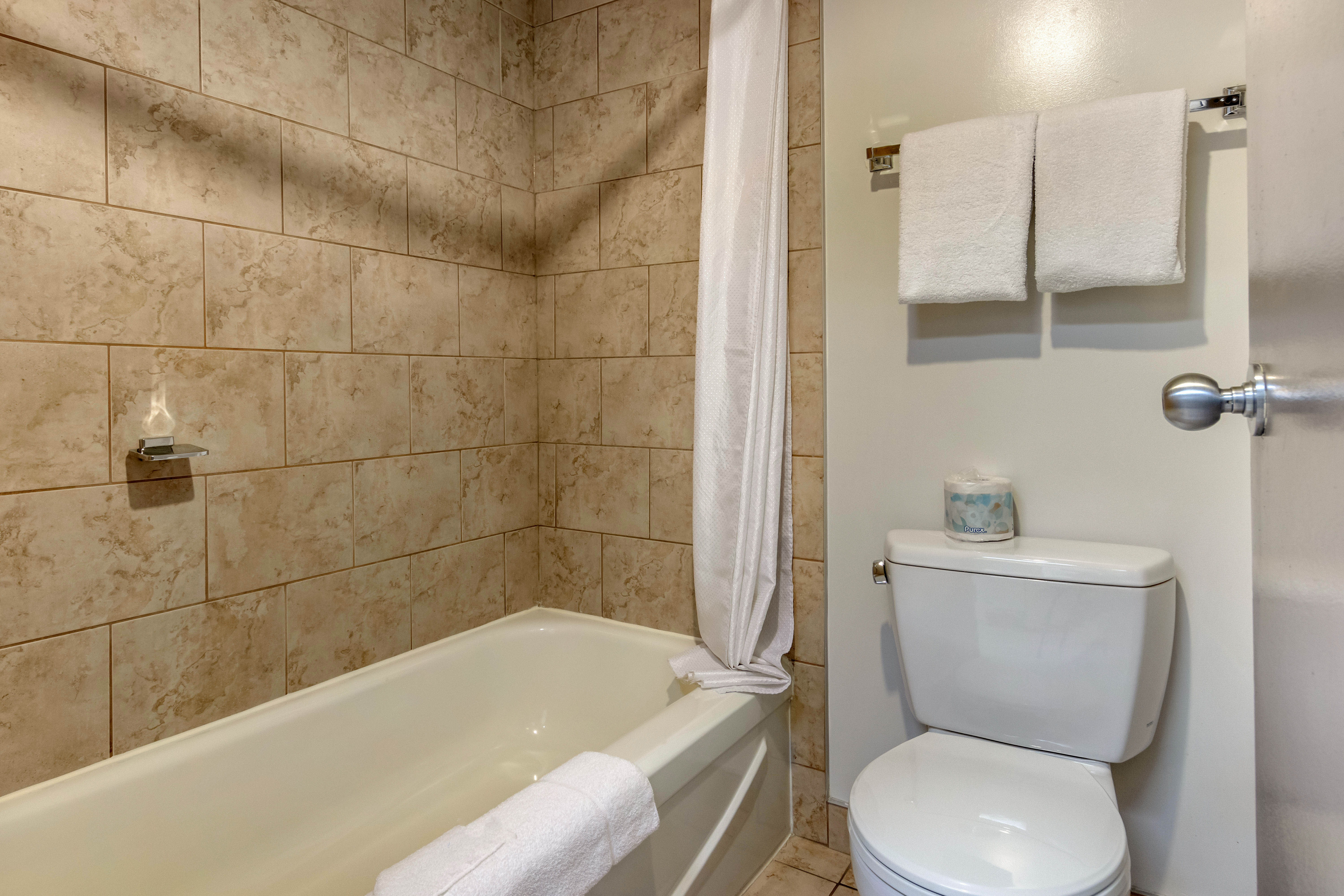 Guest room bath at the Super 8 by Wyndham Macleod Trail Calgary in Calgary, Alberta
