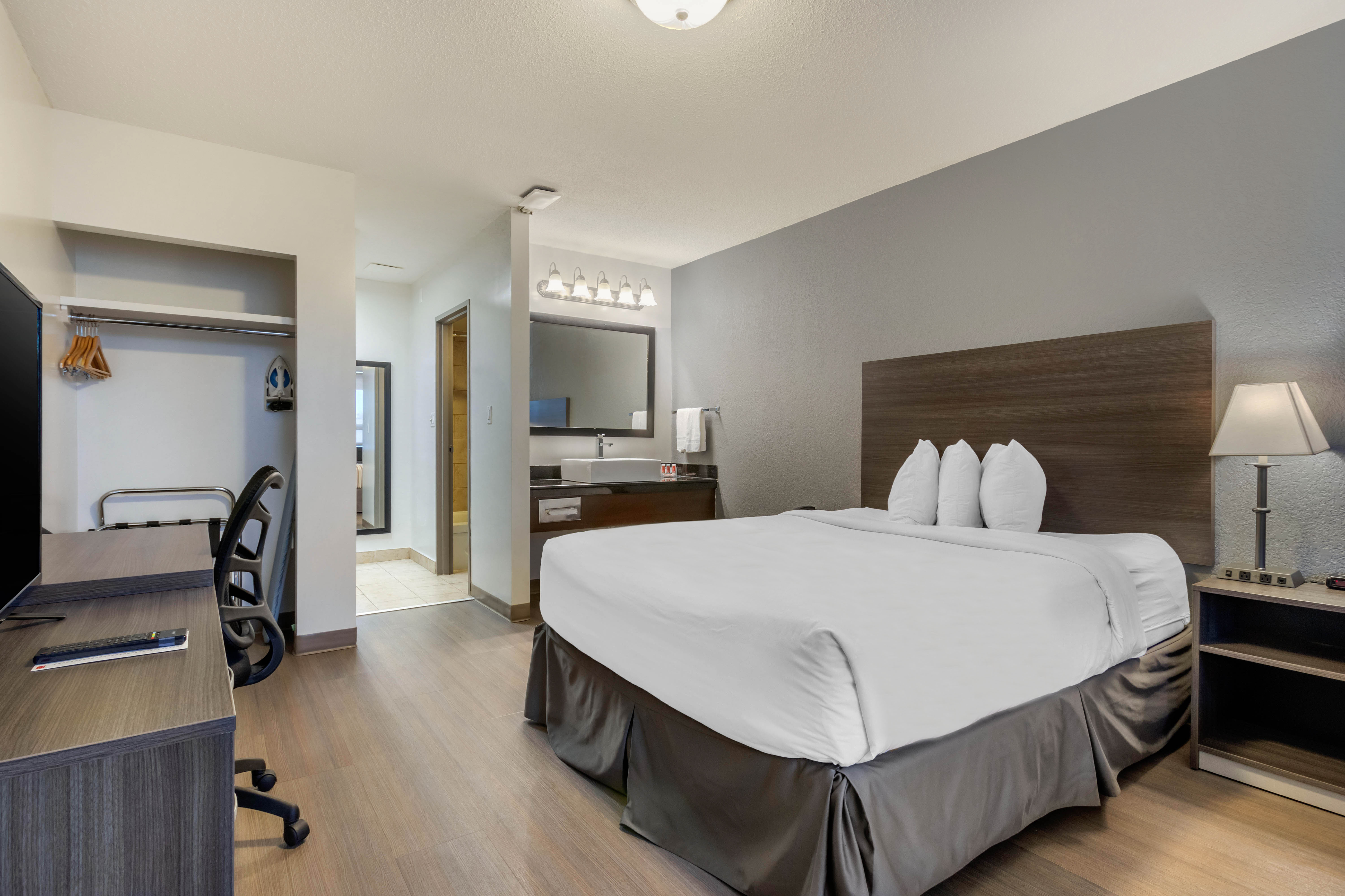 Guest room at the Super 8 by Wyndham Macleod Trail Calgary in Calgary, Alberta