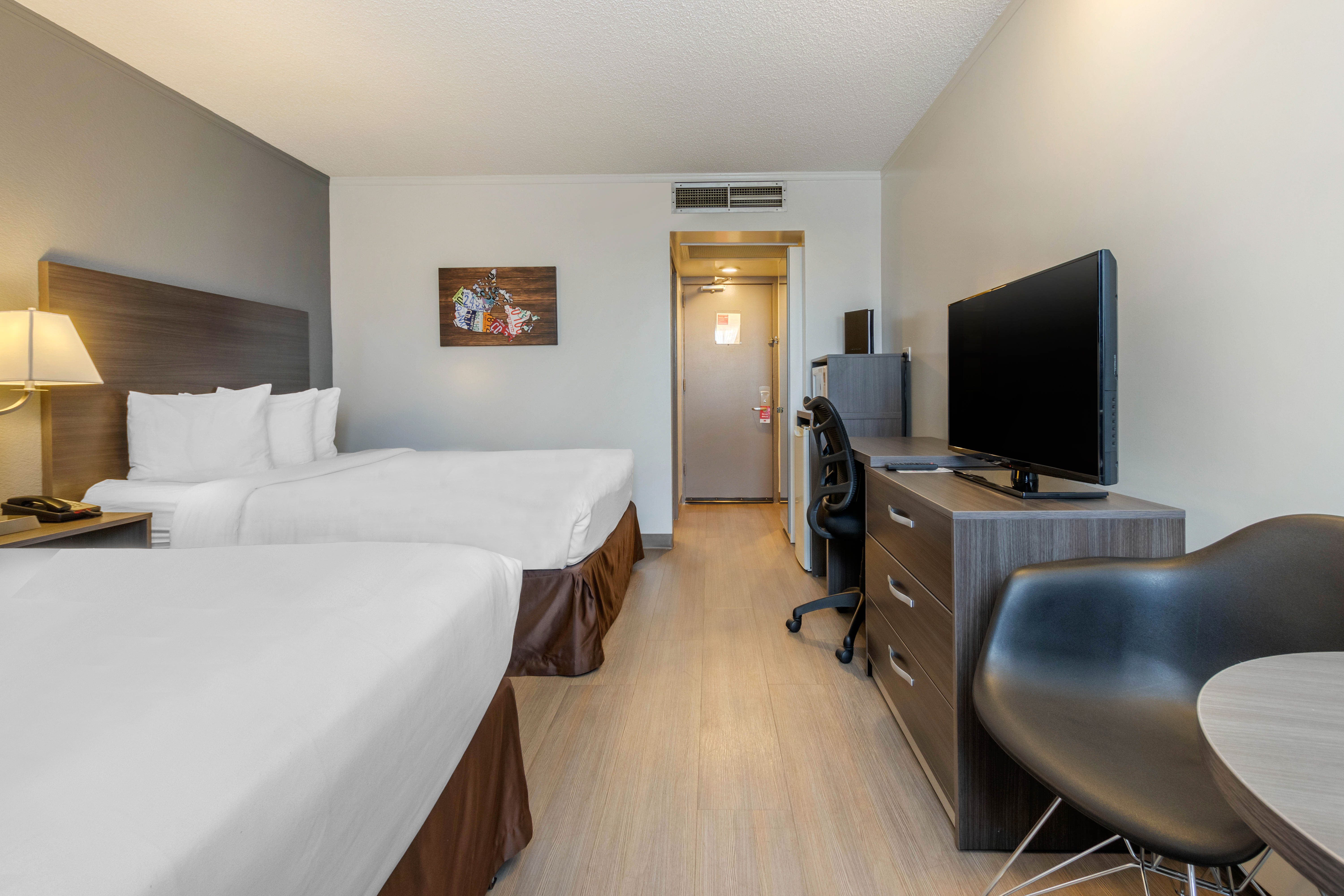 Guest room at the Super 8 by Wyndham Macleod Trail Calgary in Calgary, Alberta