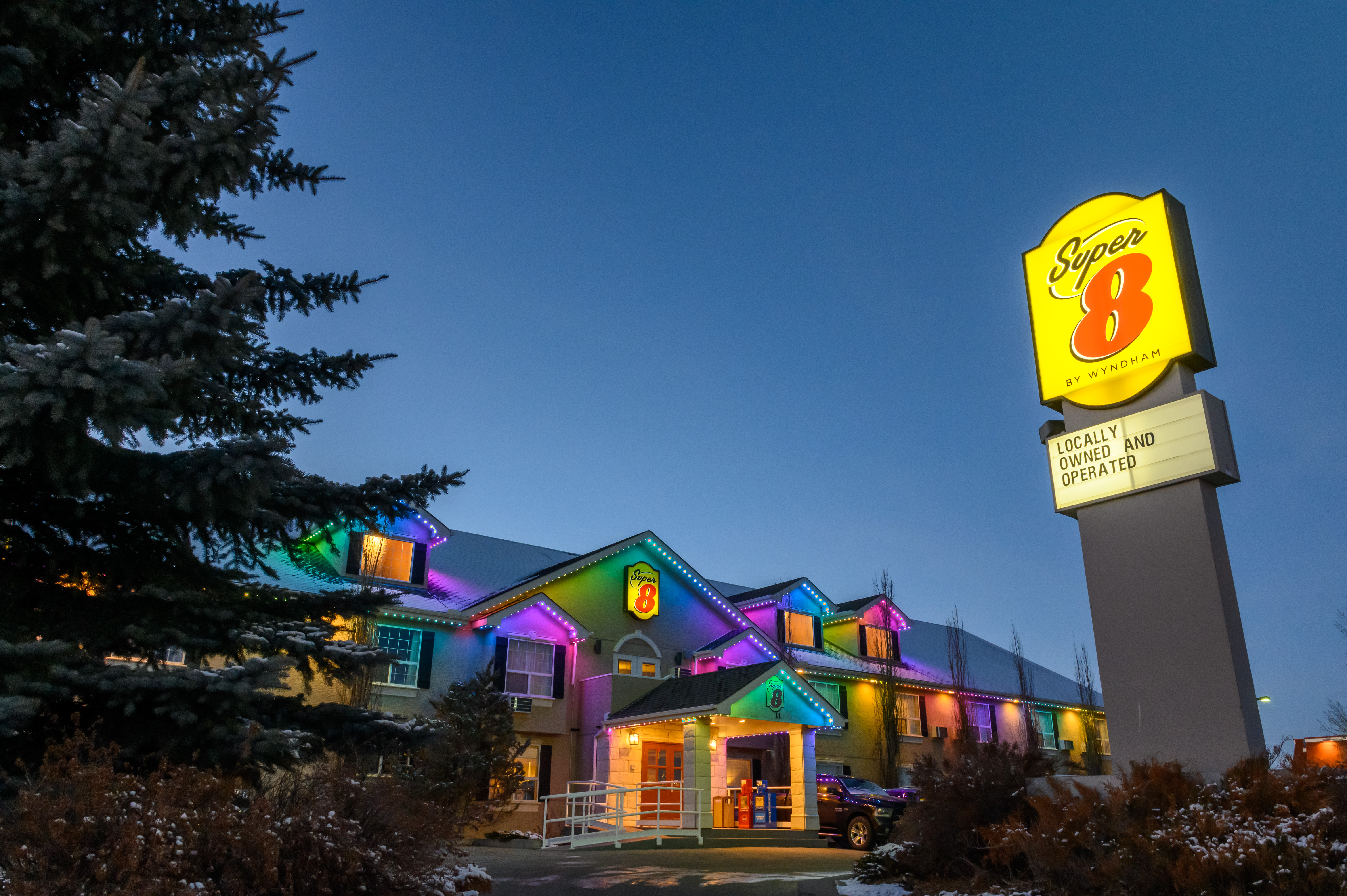 Exterior Night Image of Super 8 by Wyndham Cochrane hotel in Cochrane, Alberta