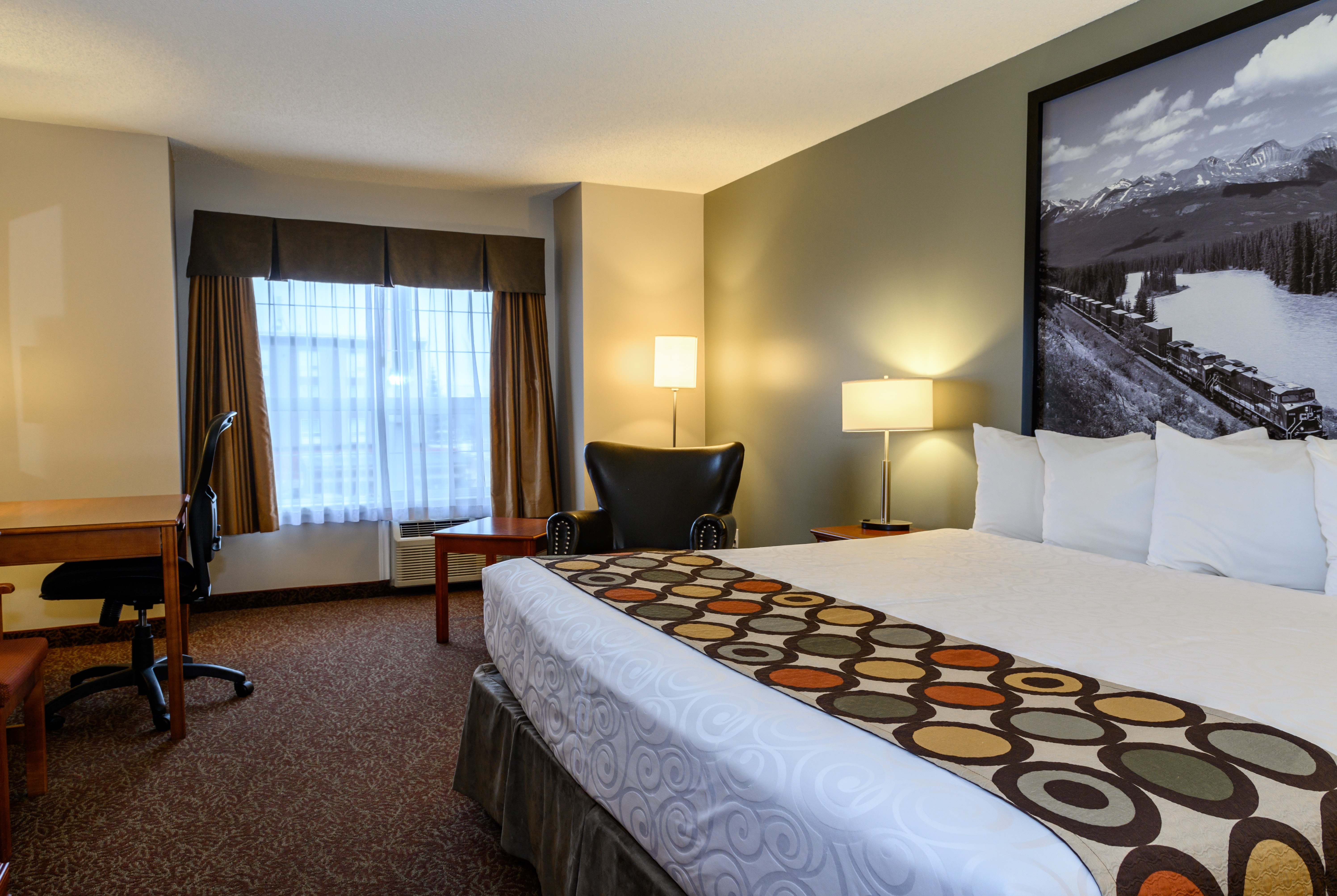 Guest room at the Super 8 by Wyndham Cochrane in Cochrane, Alberta