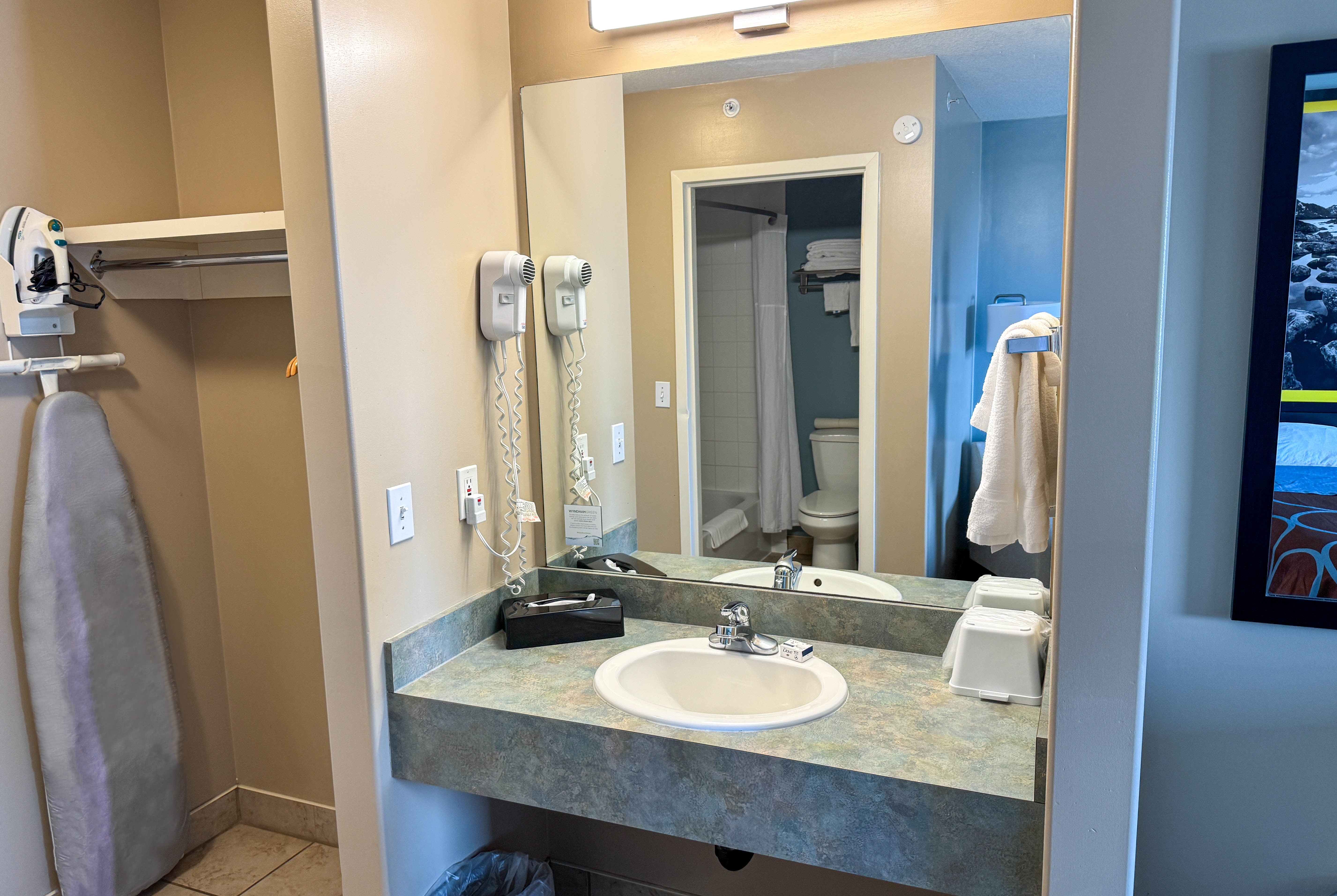 Guest room bath at the Super 8 by Wyndham Edmonton South in Edmonton, Alberta