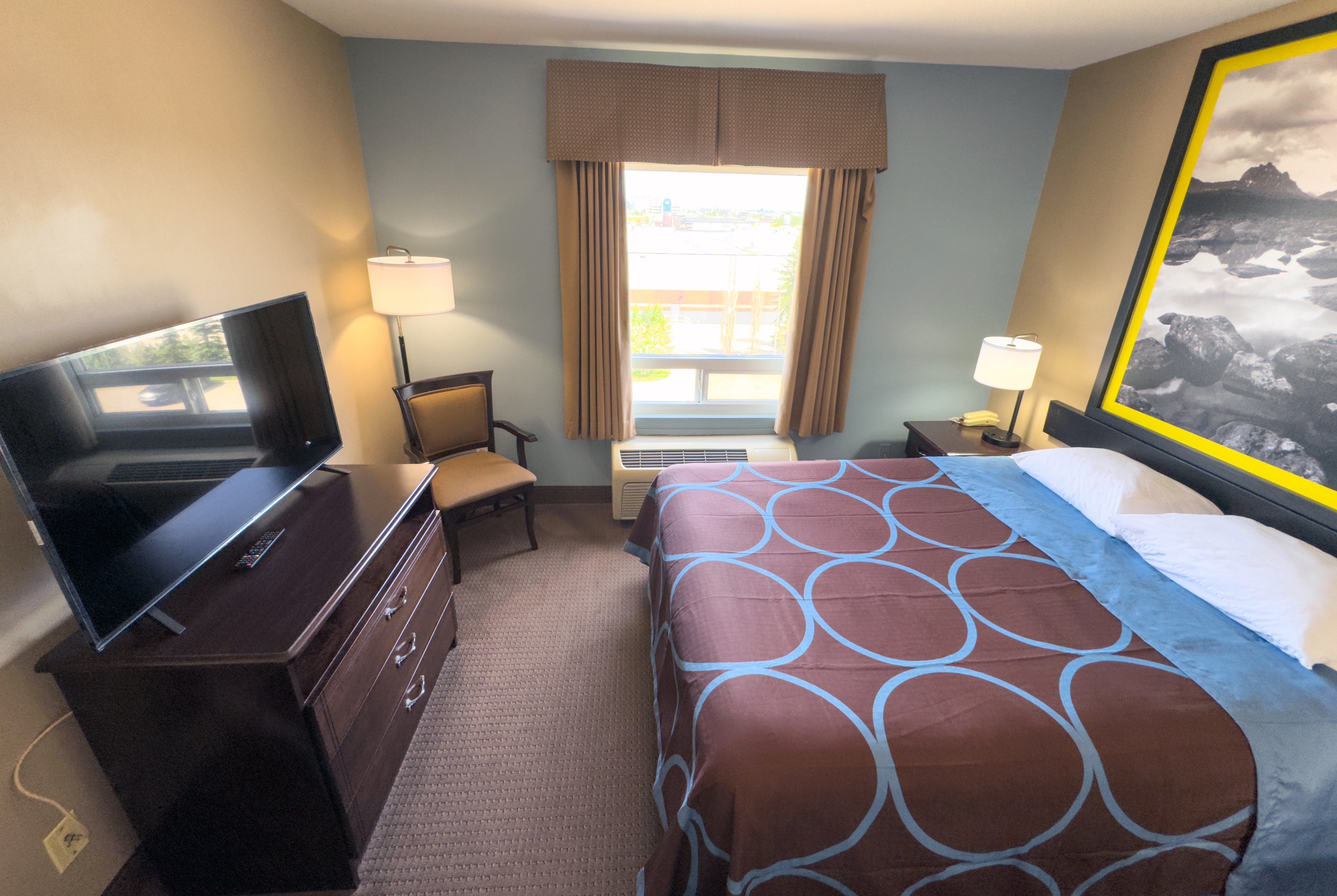Guest room at the Super 8 by Wyndham Edmonton South in Edmonton, Alberta