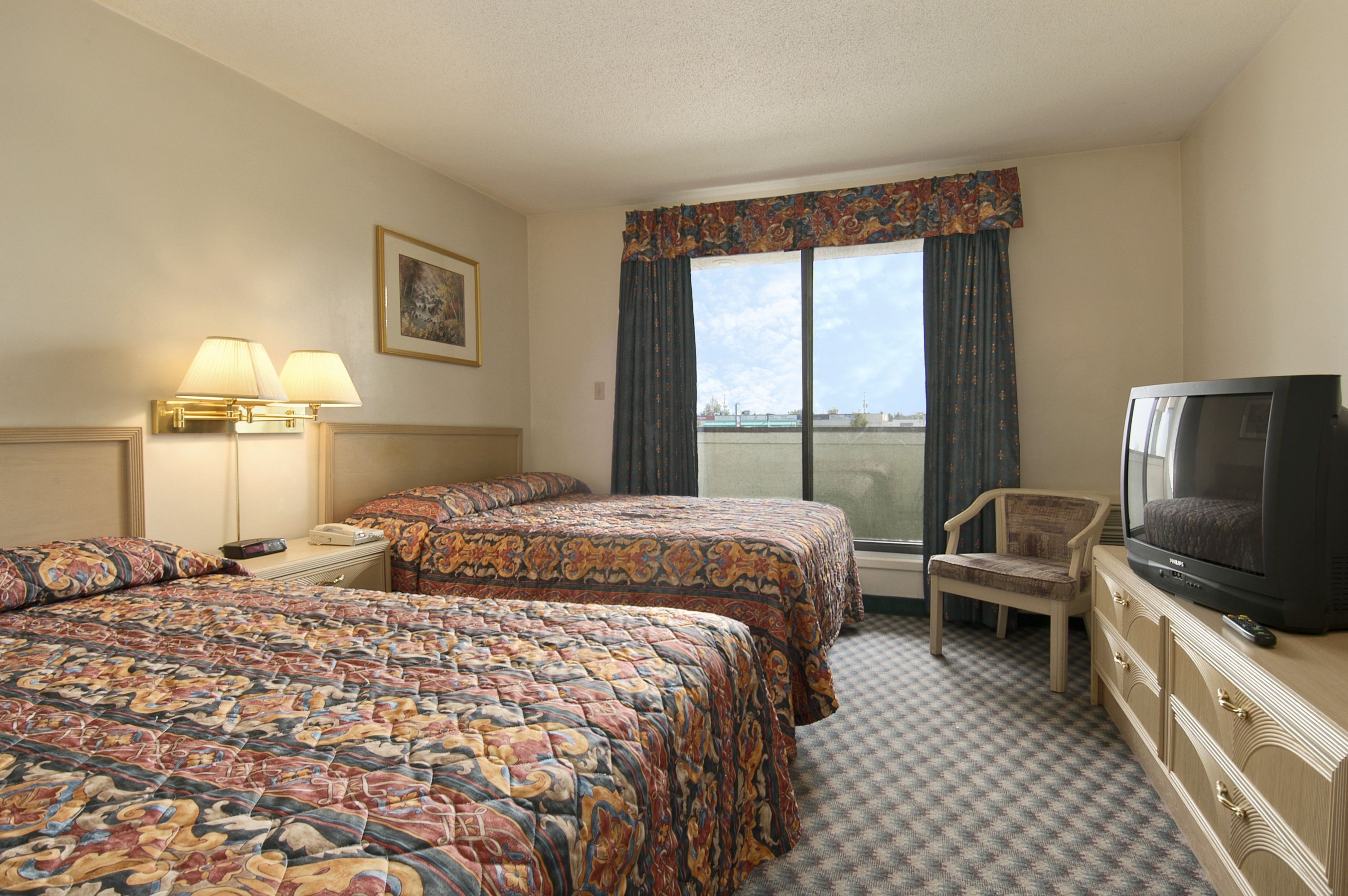 Guest room at the Super 8 by Wyndham Red Deer in Red Deer, Alberta