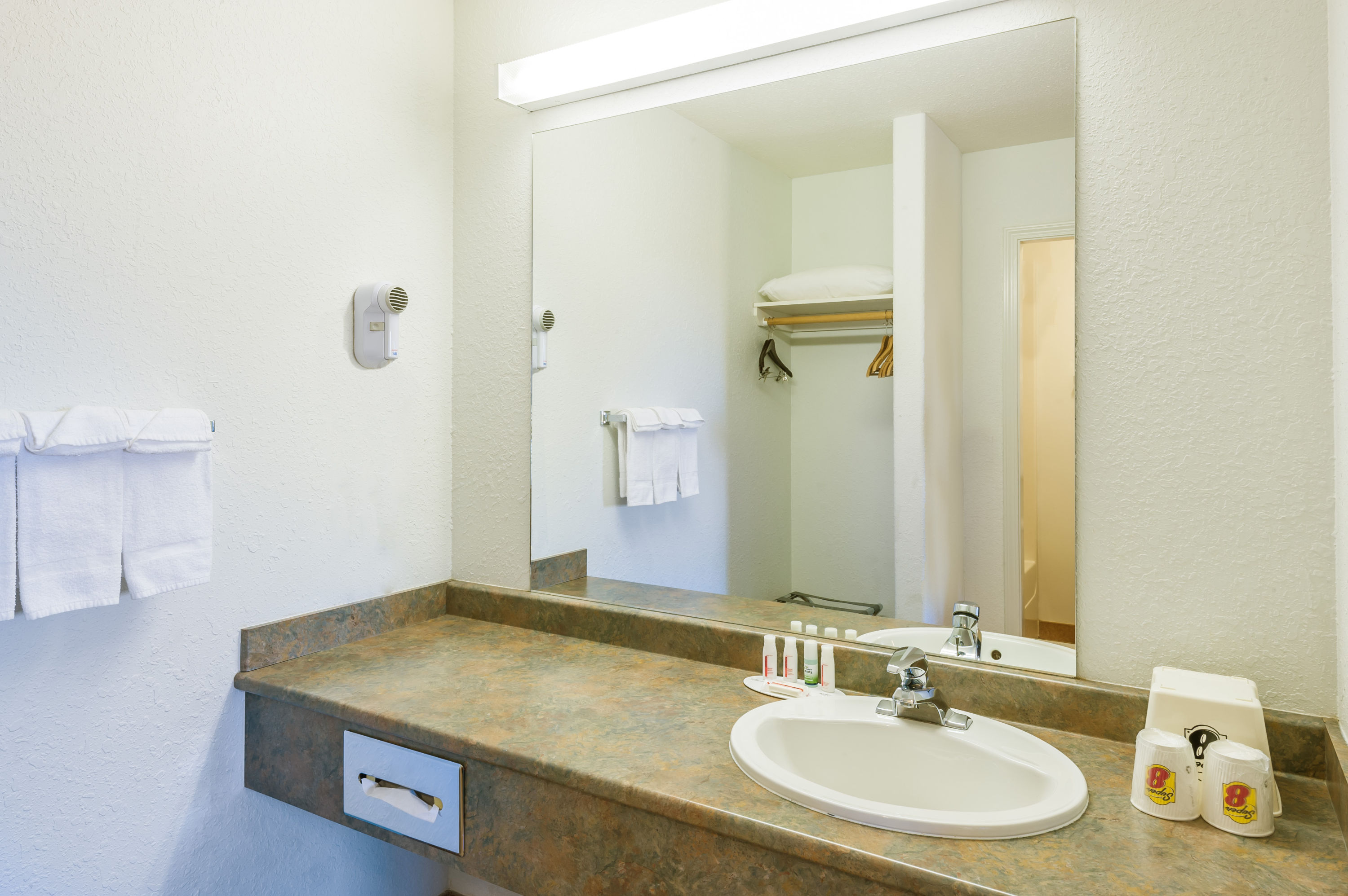 Guest room bath at the Super 8 by Wyndham 100 Mile House in 100 Mile House, British Columbia