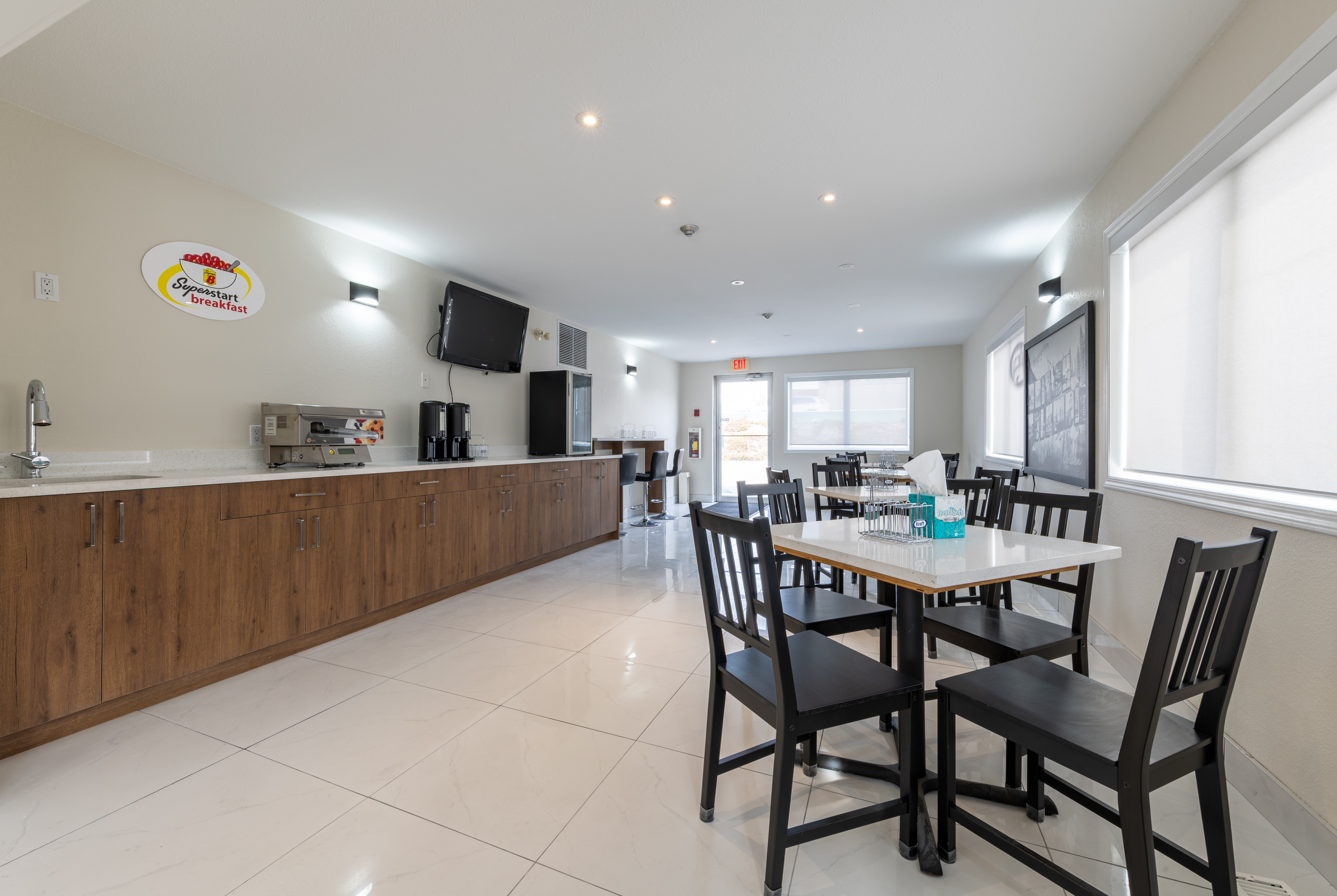 Super 8 by Wyndham Golden restaurant breakfast area with seating in Golden, British Columbia