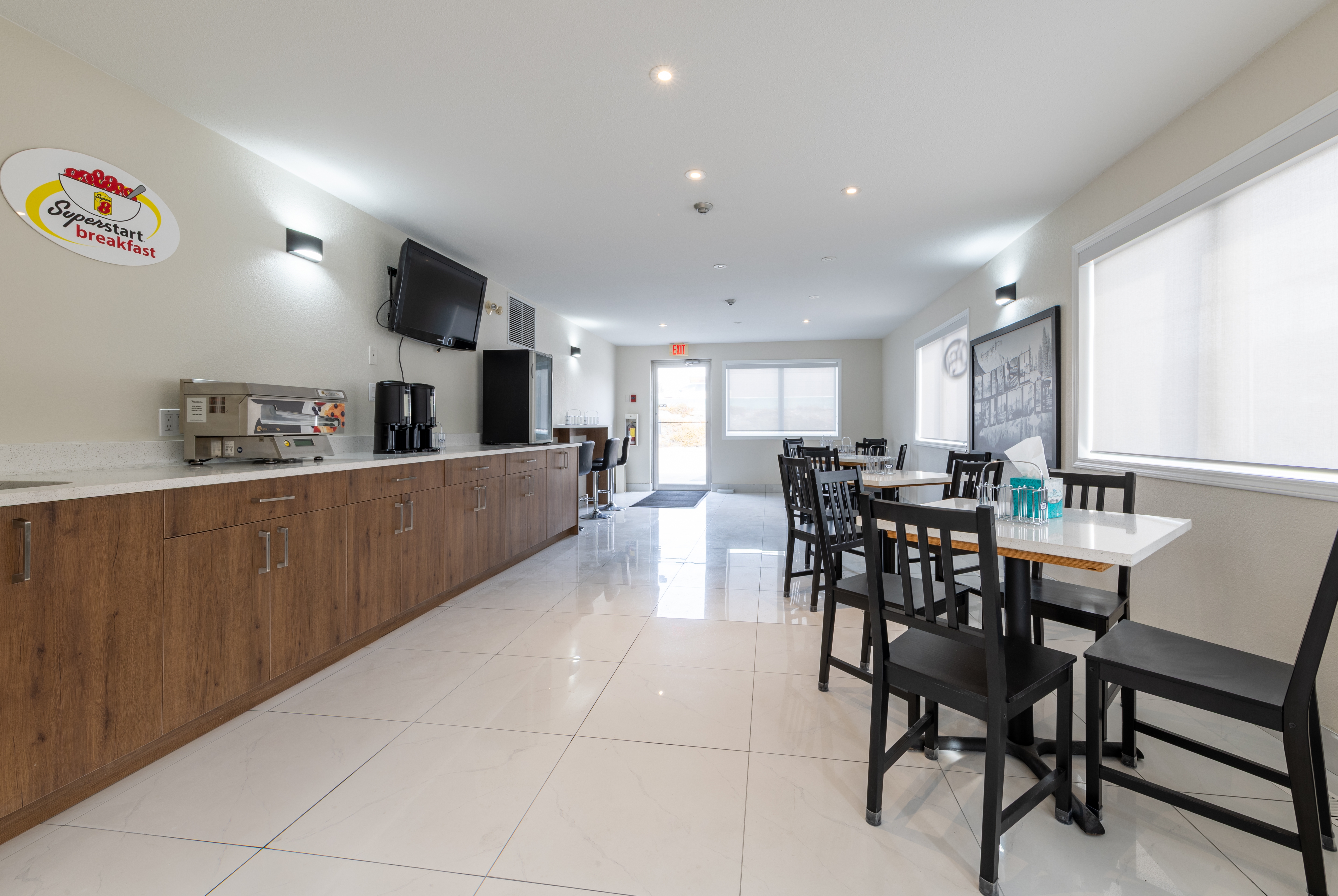 Super 8 by Wyndham Golden restaurant breakfast area with seating in Golden, British Columbia