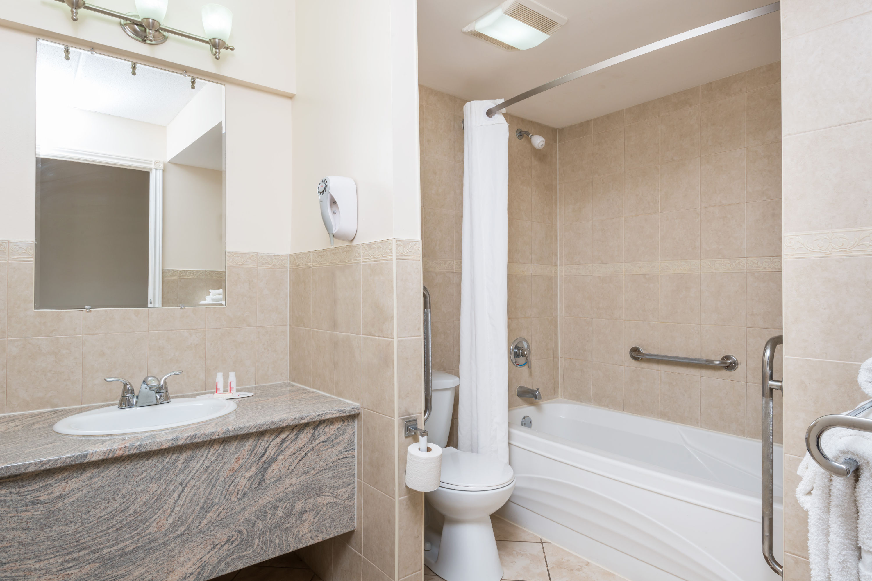 Guest room at the Super 8 by Wyndham Cambridge/Kitchener/Waterloo Area in Cambridge, Ontario