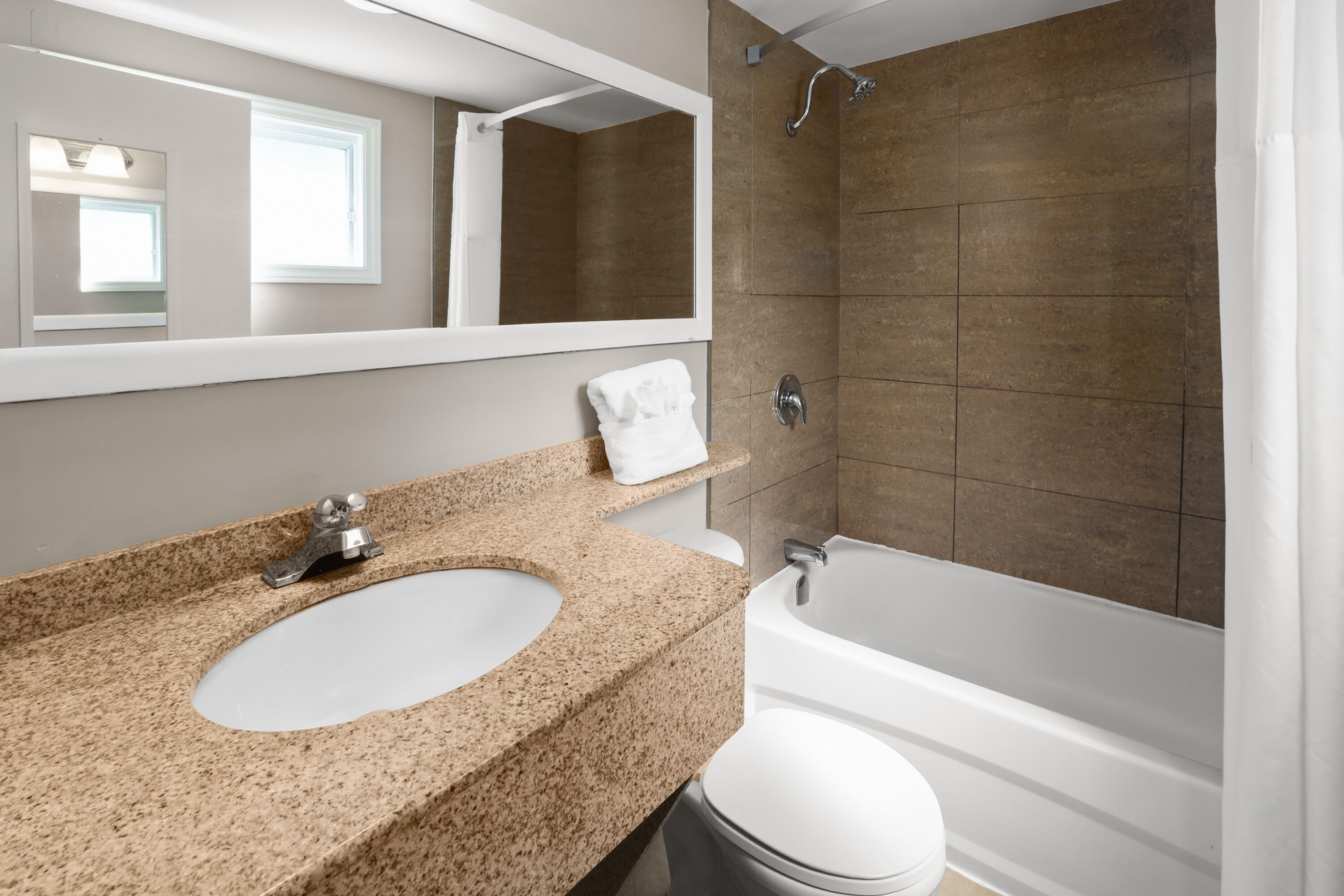 Guest room bath at the Super 8 by Wyndham Gananoque/Country Squire Resort in Gananoque, Ontario