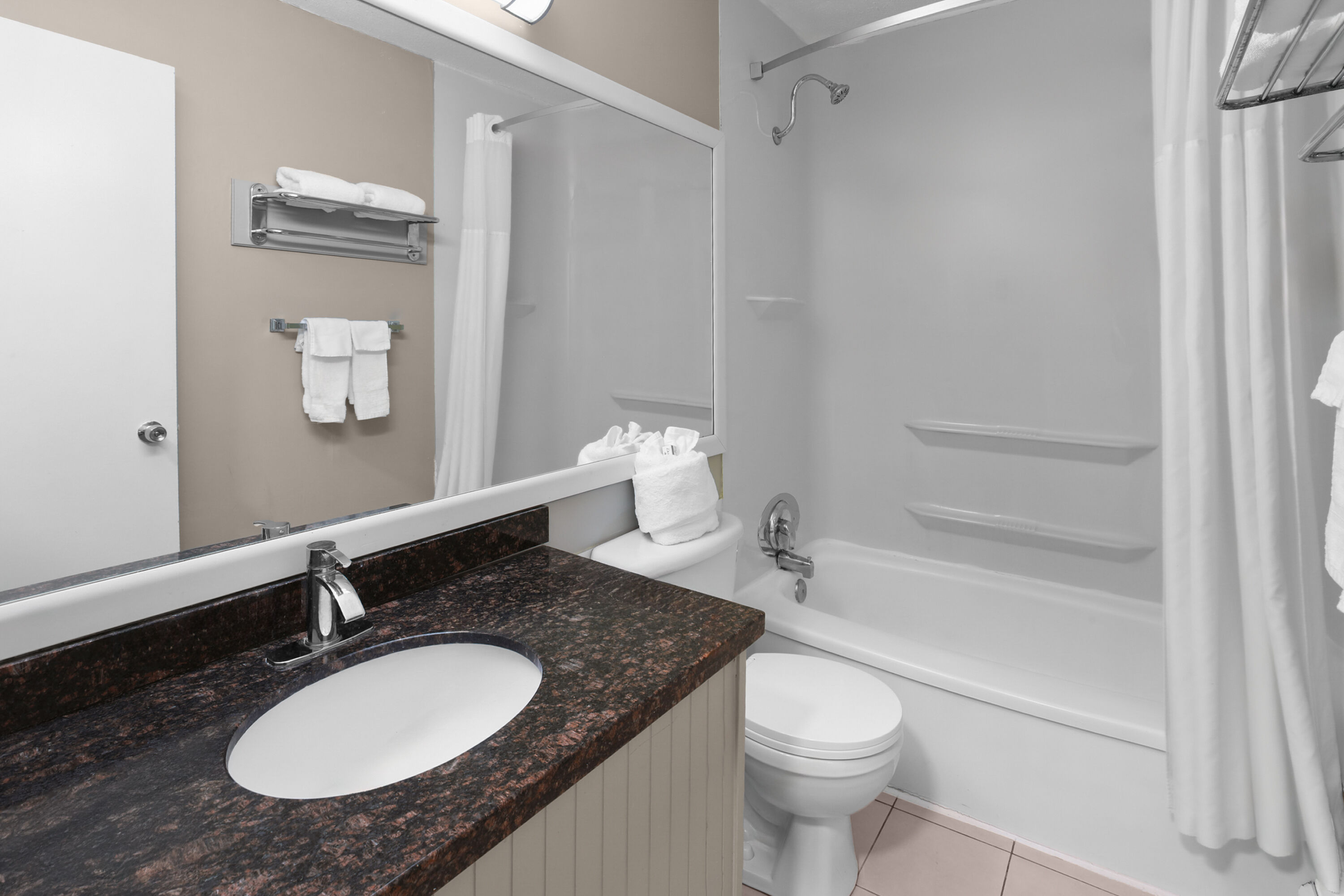 Guest room bath at the Super 8 by Wyndham Gananoque/Country Squire Resort in Gananoque, Ontario