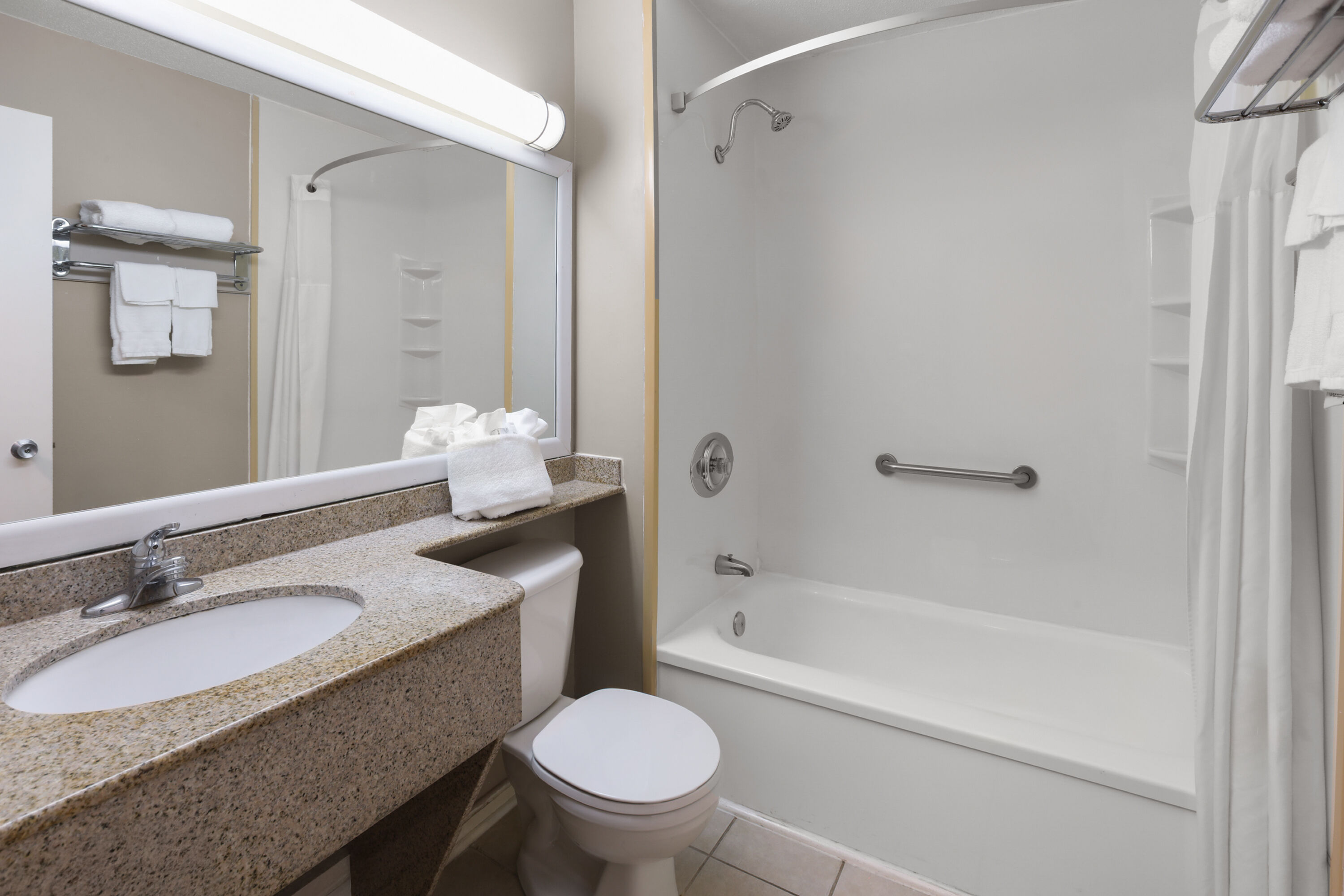 Guest room bath at the Super 8 by Wyndham Gananoque/Country Squire Resort in Gananoque, Ontario