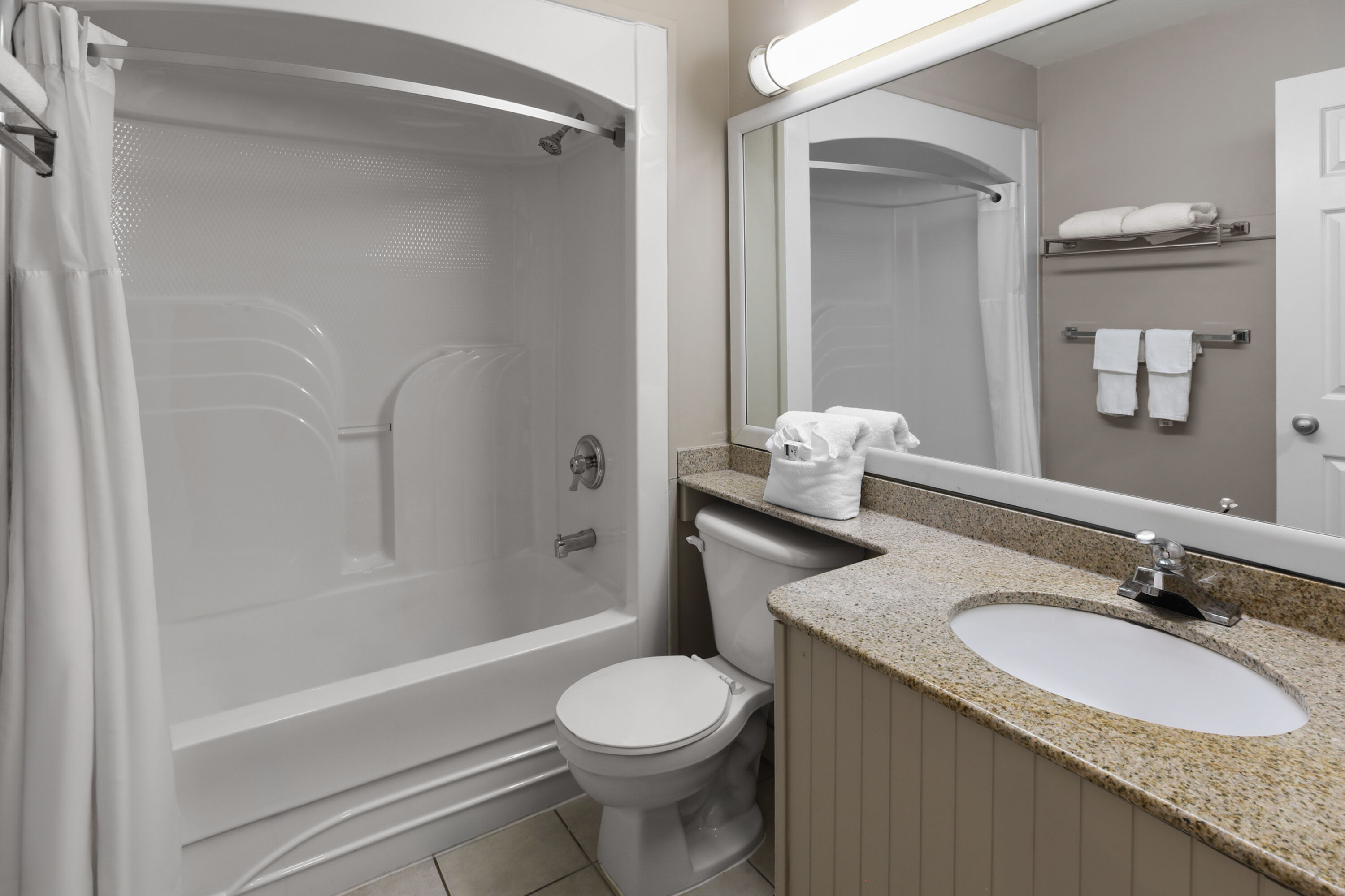 Guest room bath at the Super 8 by Wyndham Gananoque/Country Squire Resort in Gananoque, Ontario