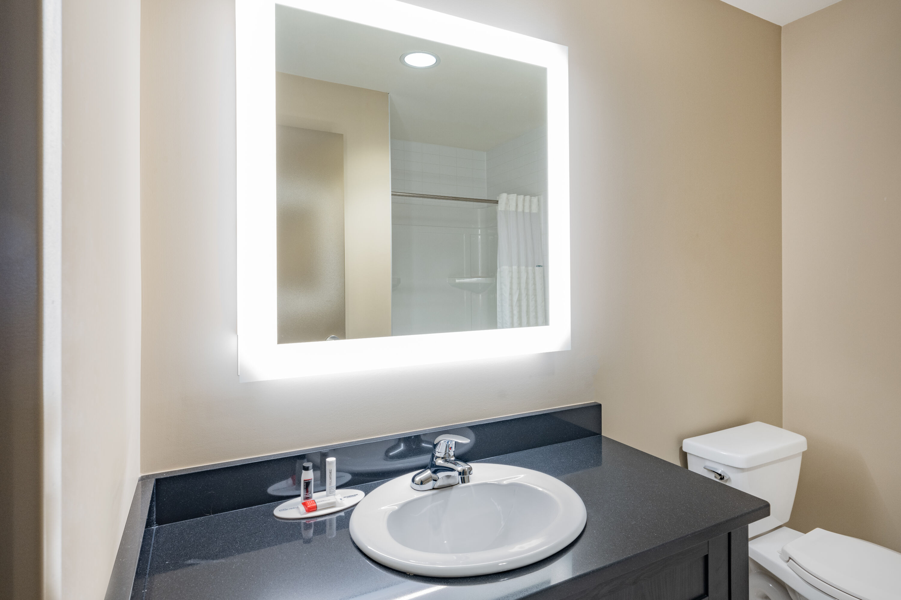 Guest room bath at the Super 8 by Wyndham Moosonee in Moosonee, Ontario