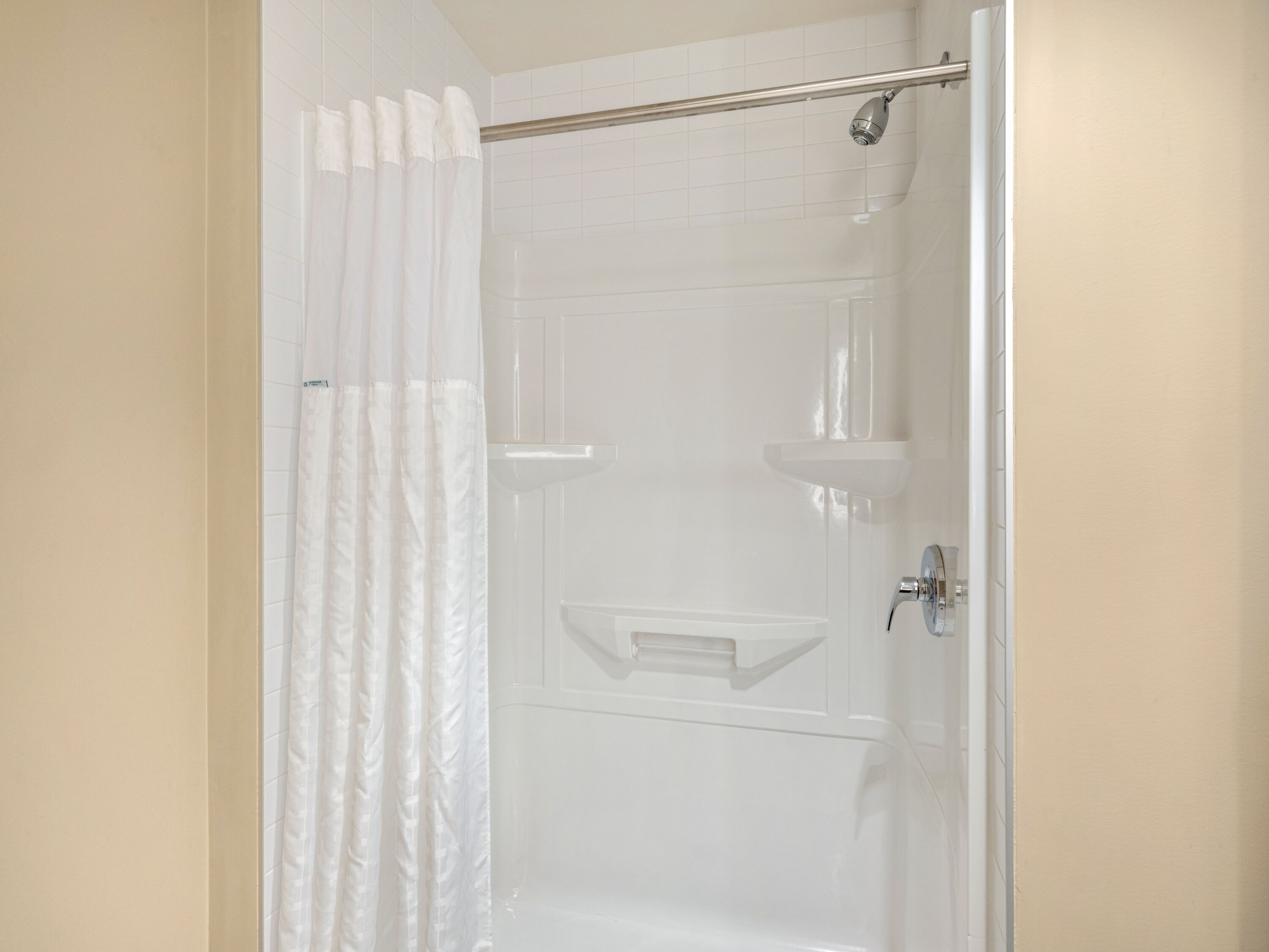 Guest room bath at the Super 8 by Wyndham Moosonee in Moosonee, Ontario