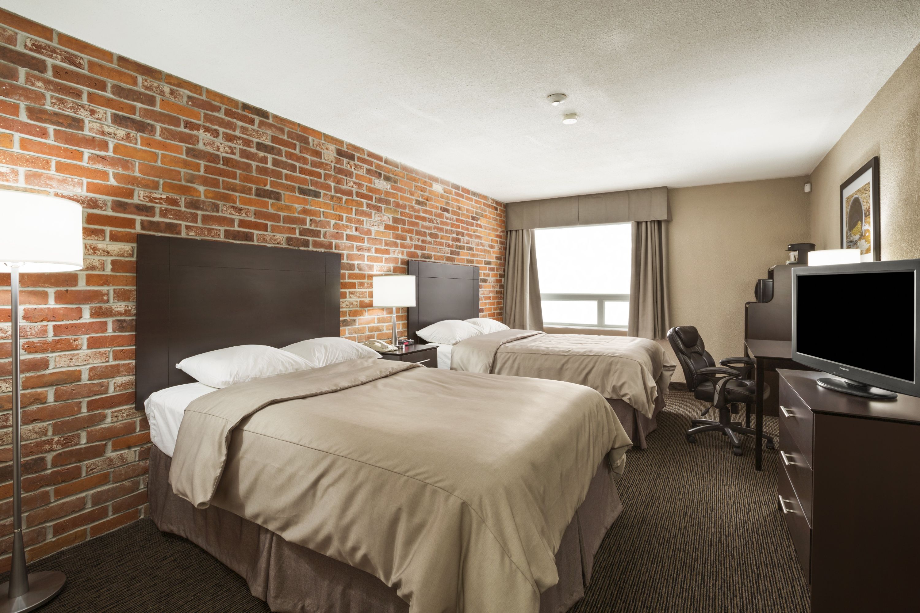 Guest room at the Super 8 by Wyndham Timmins ON in Timmins, Ontario