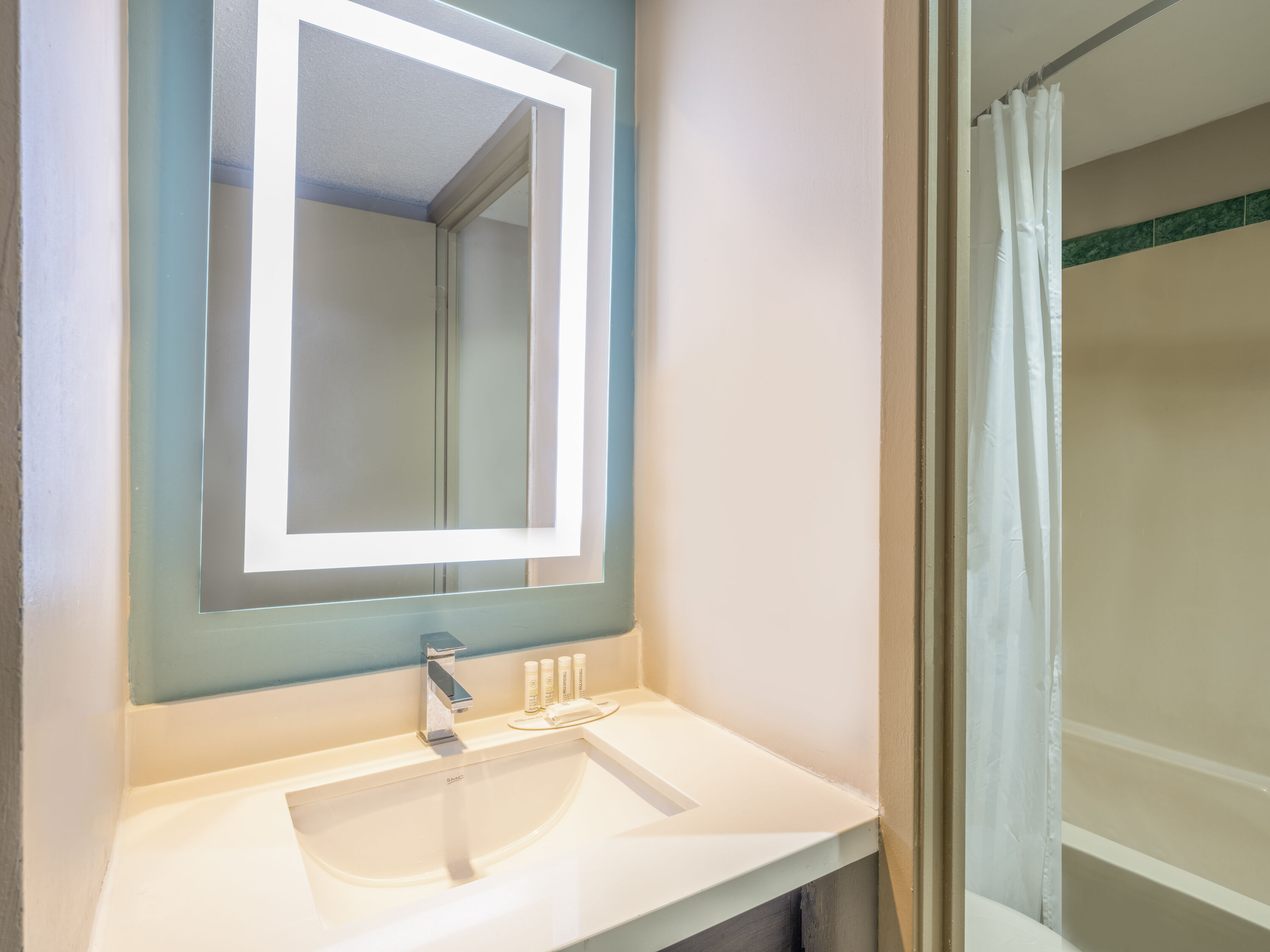 Guest room bath at the Super 8 by Wyndham Toronto East ON in Toronto, Ontario