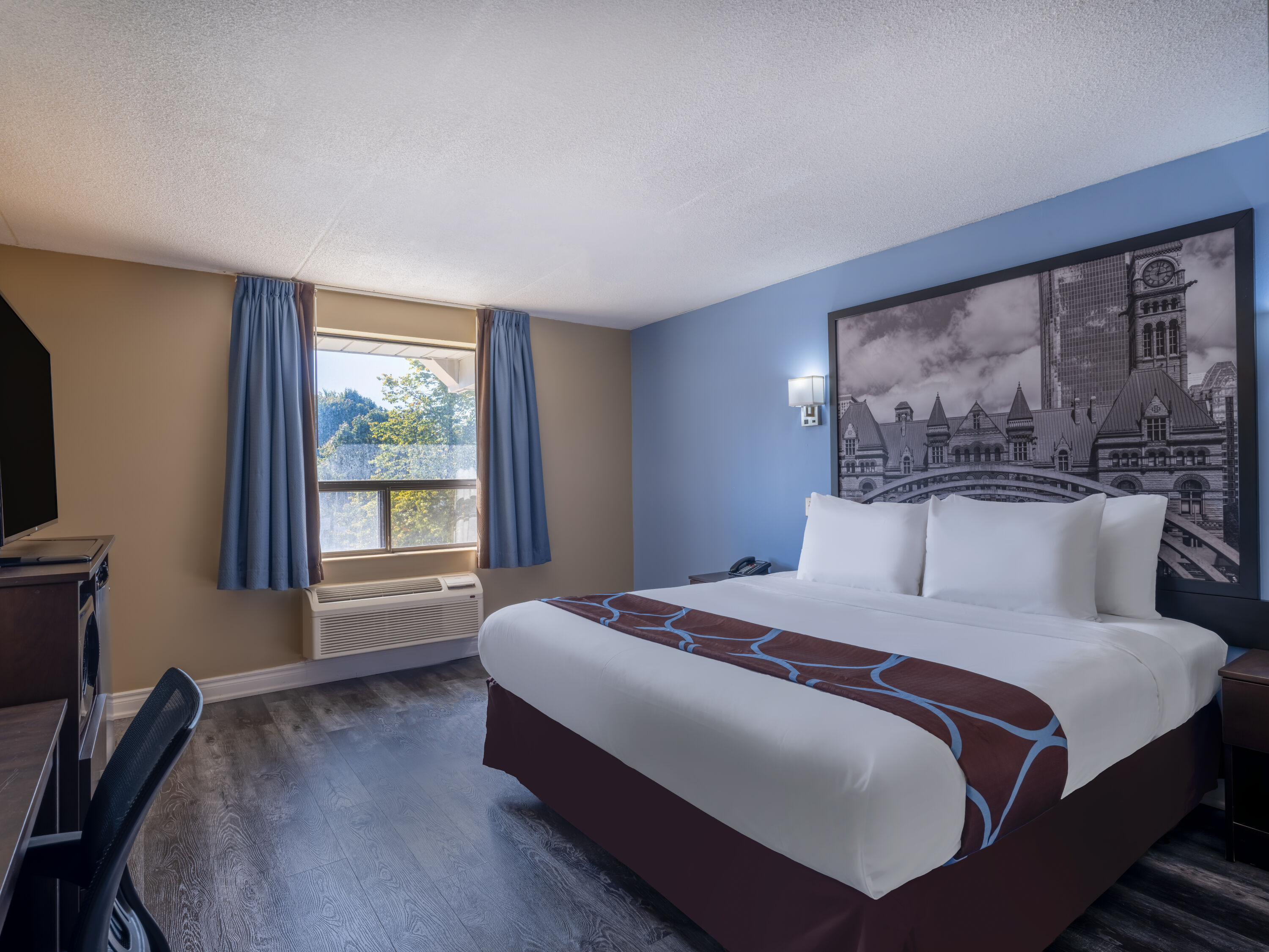 Guest room at the Super 8 by Wyndham Toronto East ON in Toronto, Ontario
