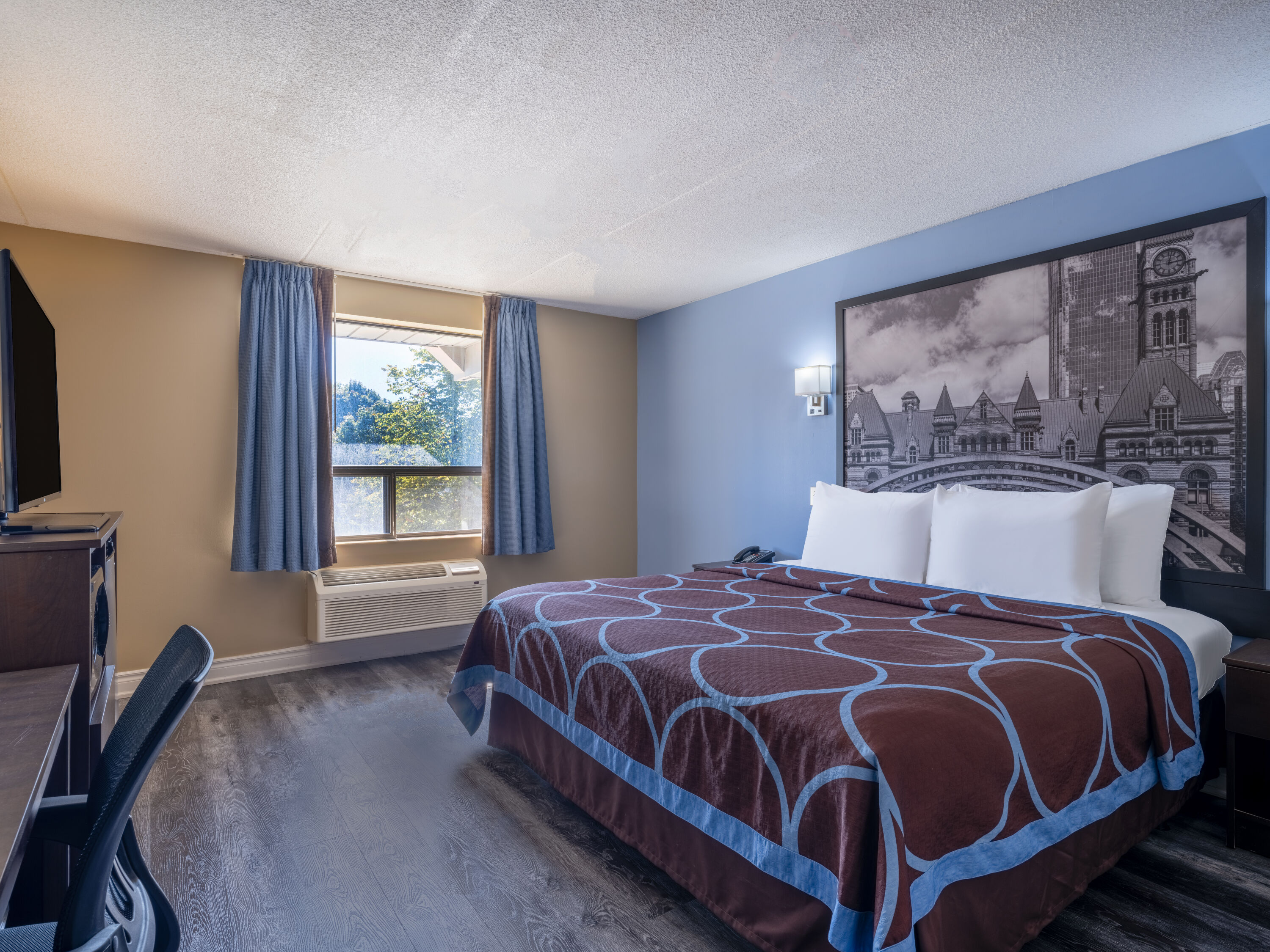 Guest room at the Super 8 by Wyndham Toronto East ON in Toronto, Ontario