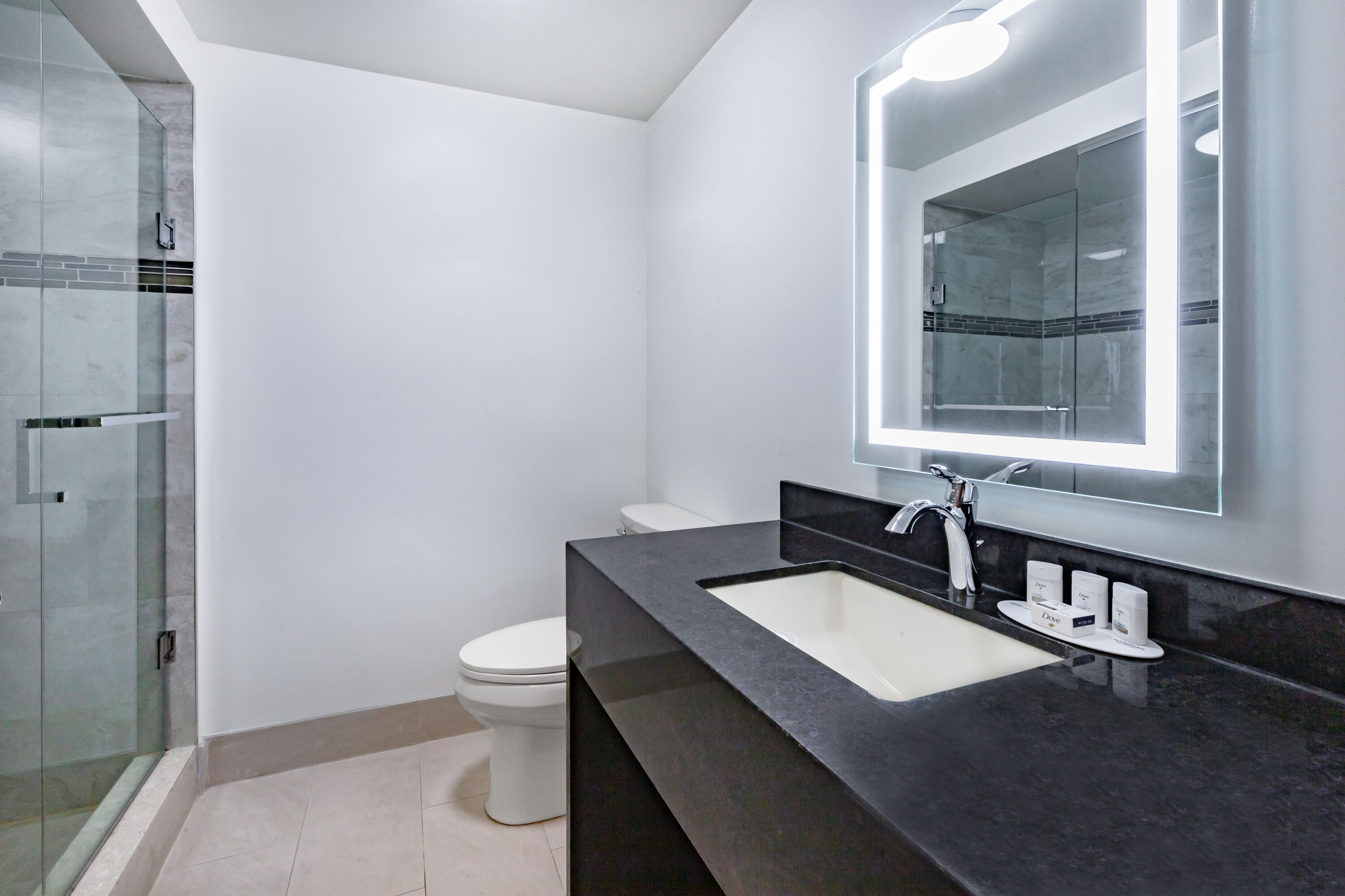 Guest room bath at the Super 8 by Wyndham Ambassador Bridge Windsor ON in Windsor, Ontario