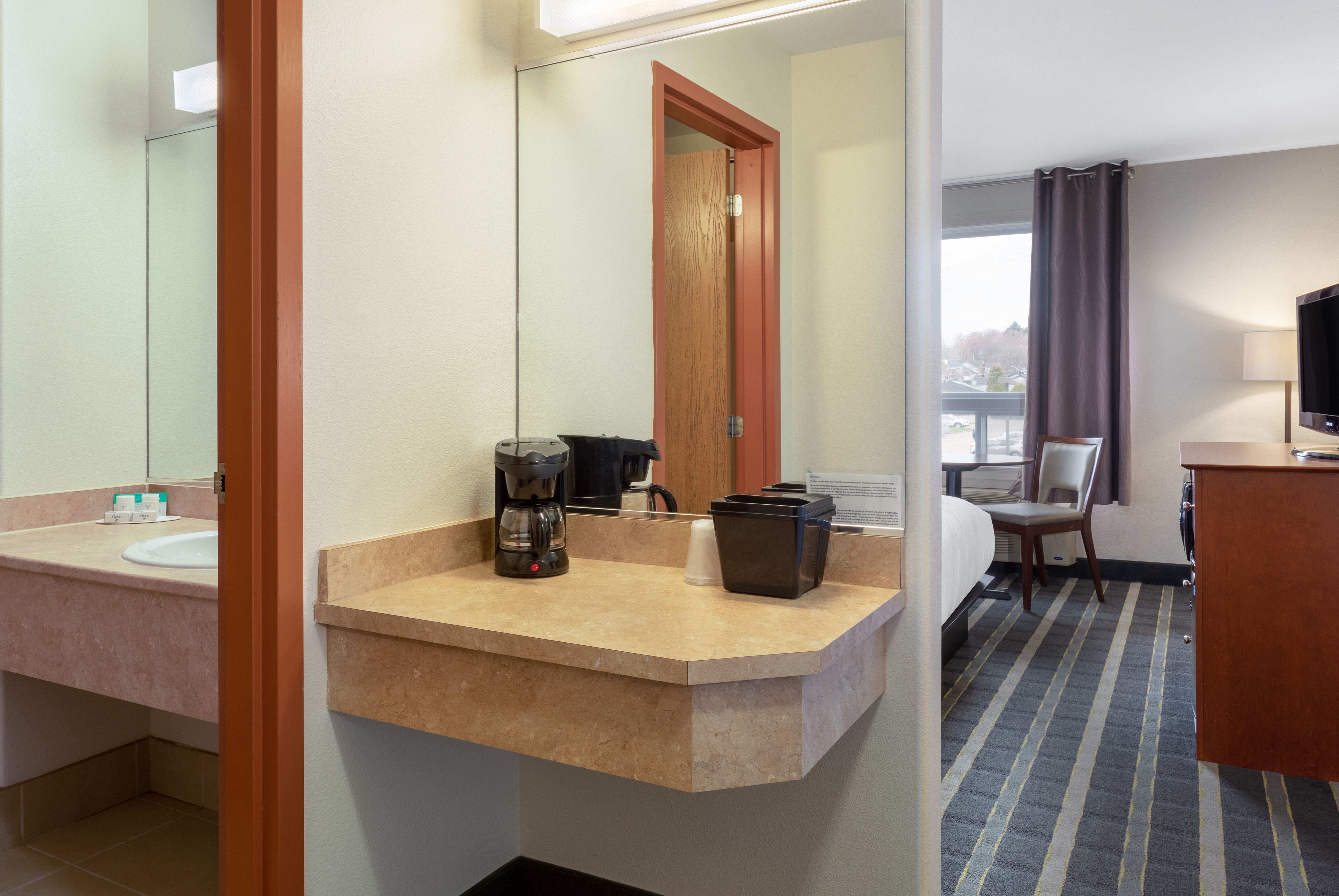 Guest room at the Super 8 by Wyndham Trois-Rivieres in Trois-Rivieres, Quebec