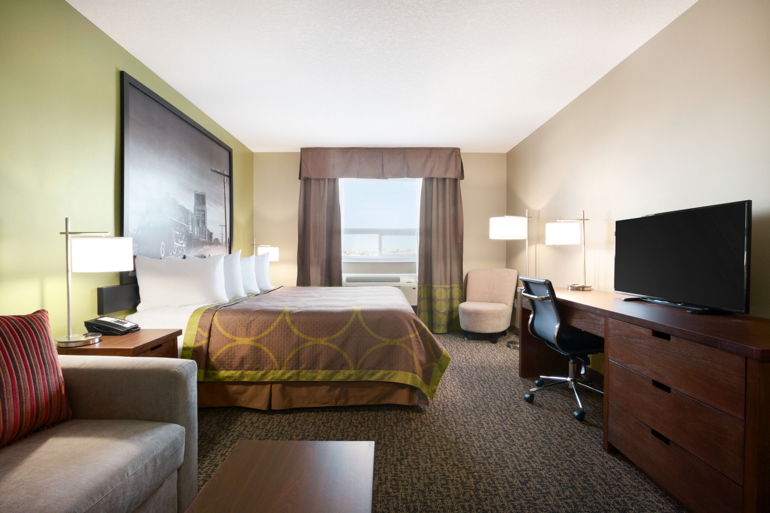 Guest room at the Super 8 by Wyndham Regina in Regina, Saskatchewan