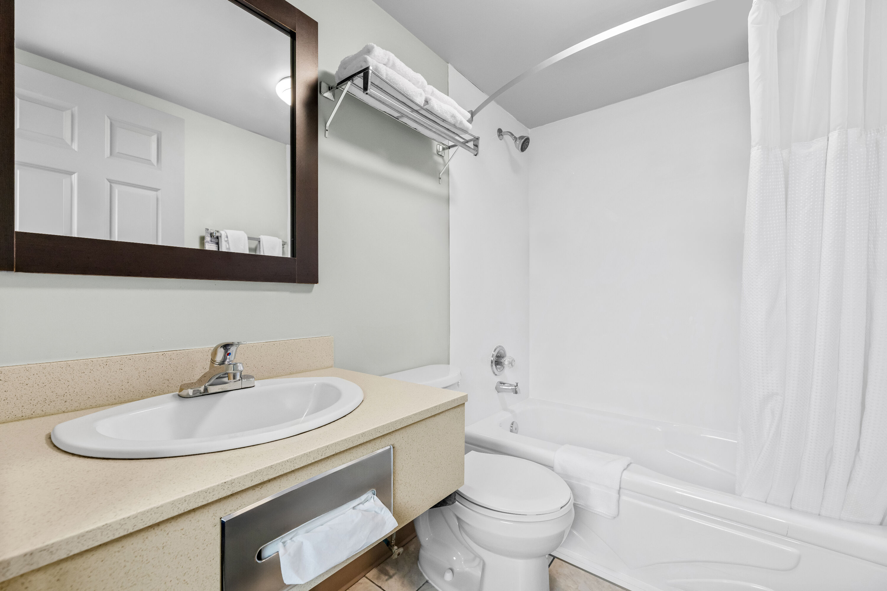 Guest room bath at the Super 8 by Wyndham Saskatoon Near Saskatoon Airport in Saskatoon, Saskatchewan