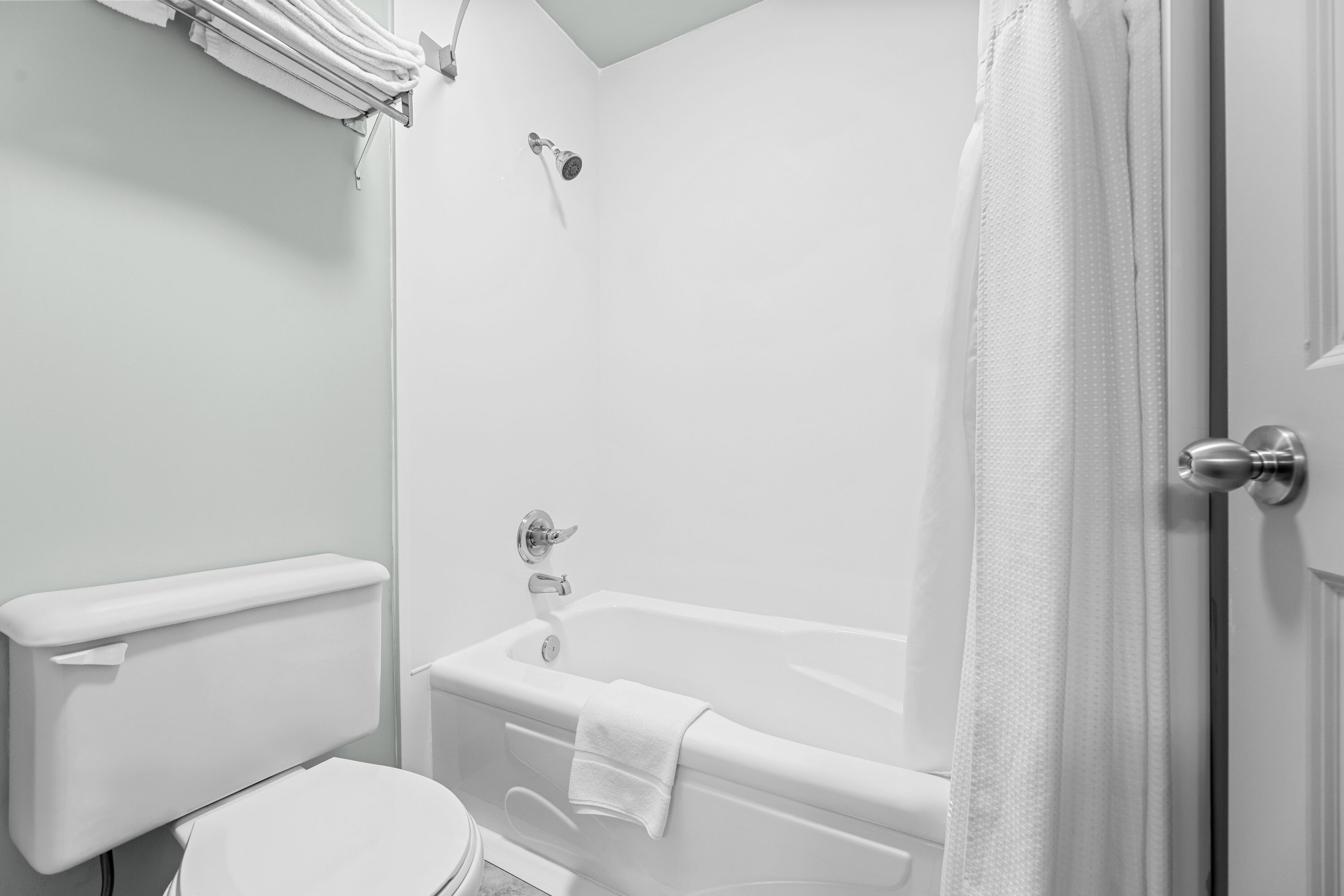 Guest room bath at the Super 8 by Wyndham Saskatoon Near Saskatoon Airport in Saskatoon, Saskatchewan