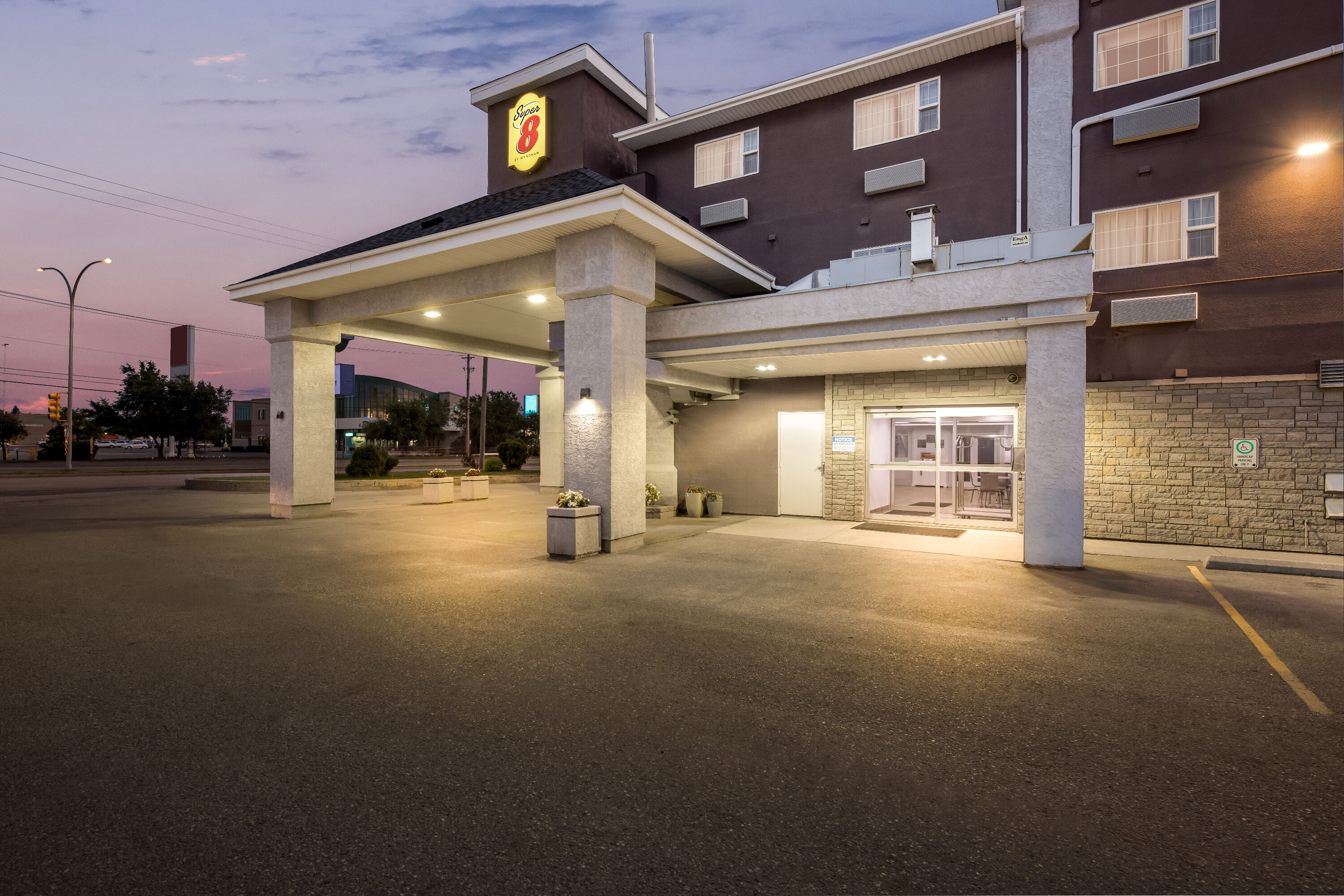 Exterior Night Image of Super 8 by Wyndham Saskatoon Near Saskatoon Airport hotel in Saskatoon, Saskatchewan