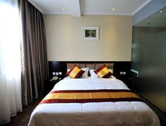 Guest room at the Super 8 by Wyndham Deyang Huashan Nan Lu in Deyang, Other than US/Canada