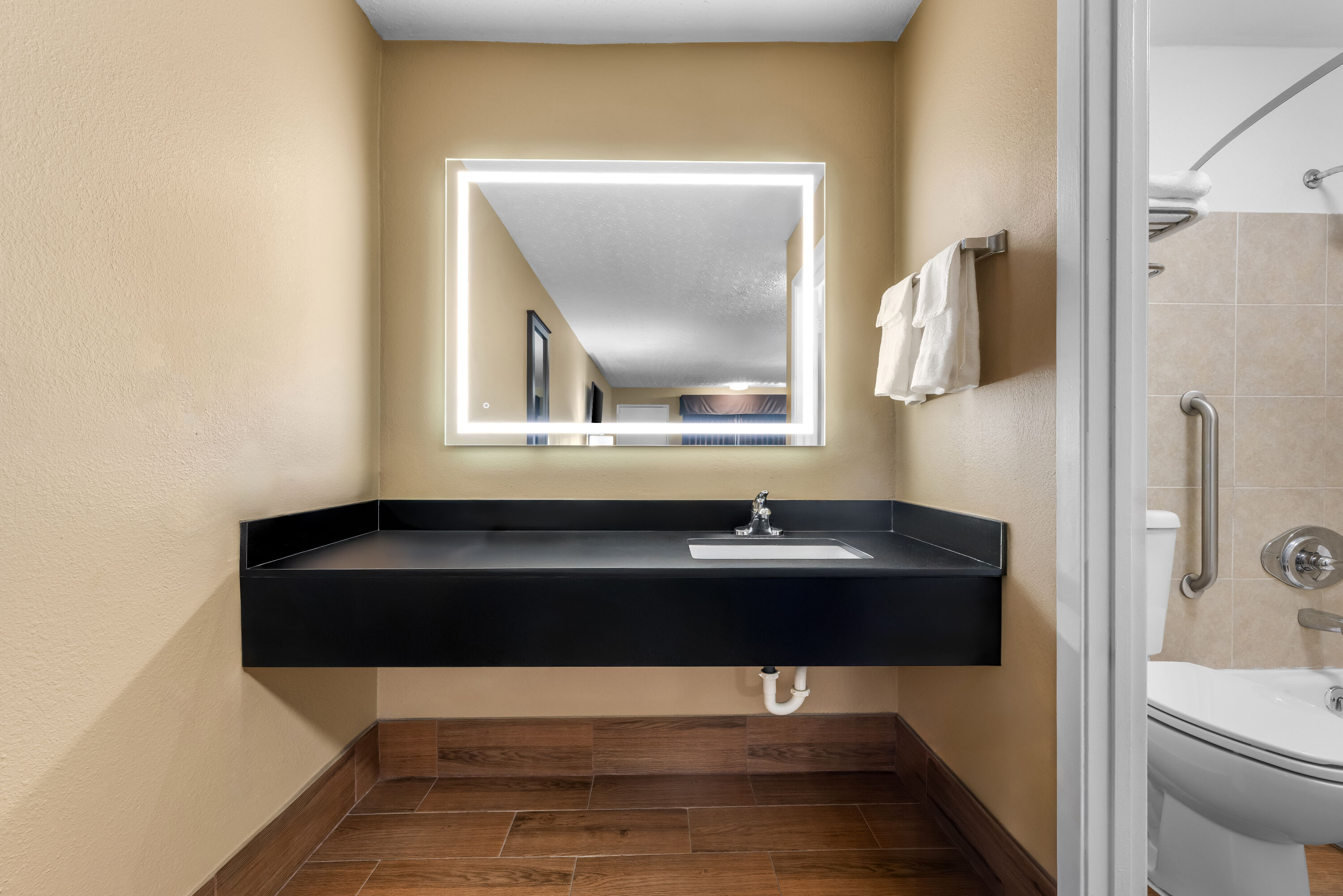 Guest room bath at the Super 8 by Wyndham Gadsden AL in Gadsden, Alabama