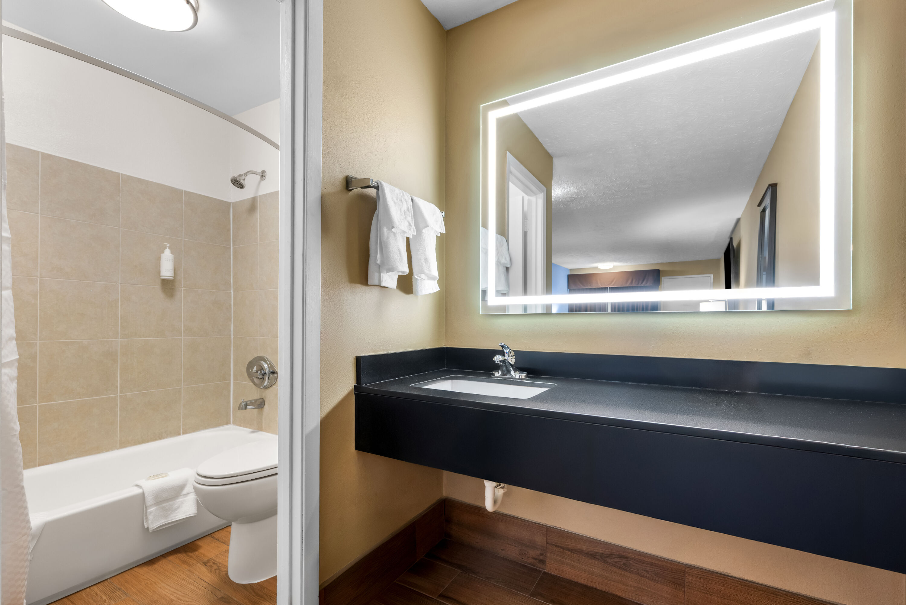 Guest room bath at the Super 8 by Wyndham Gadsden AL in Gadsden, Alabama