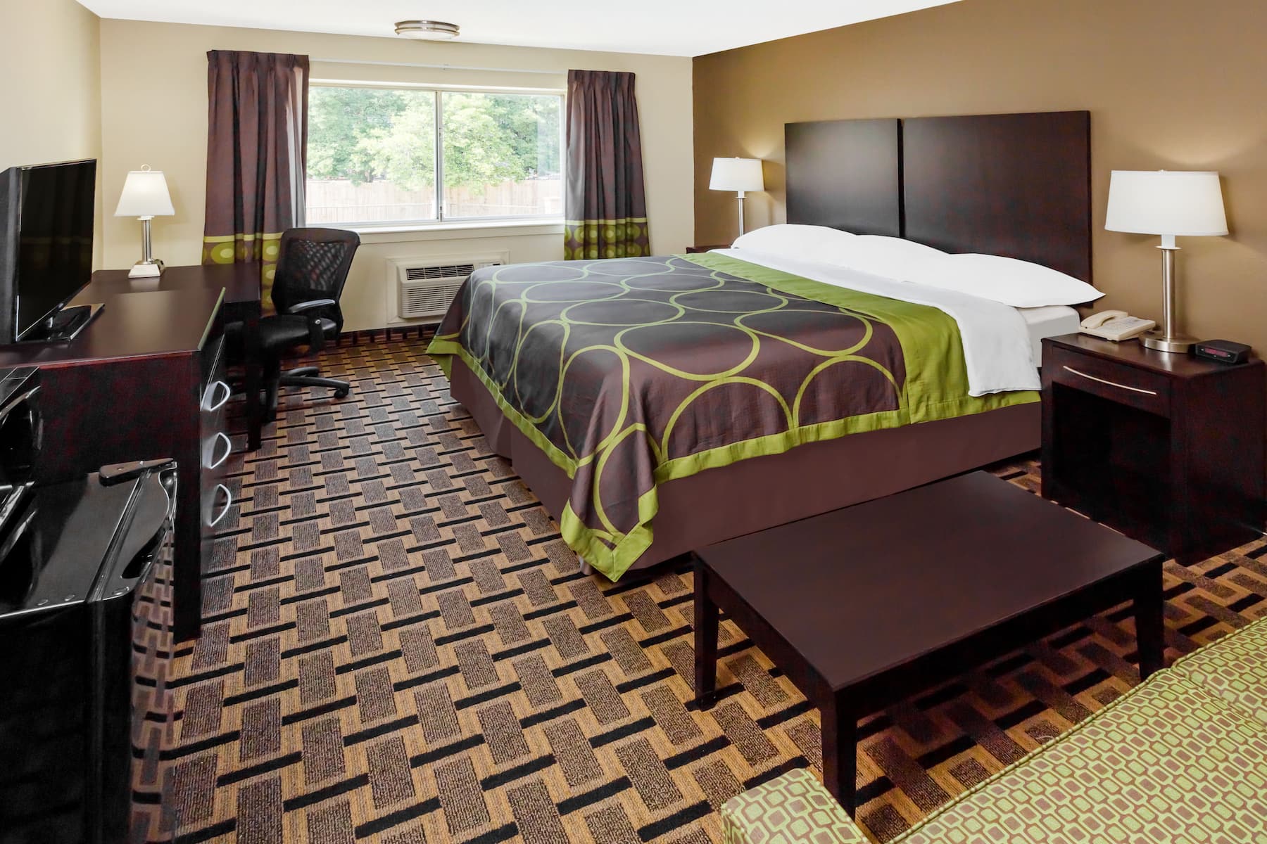 Guest room at the Super 8 by Wyndham Phenix City in Phenix City, Alabama.