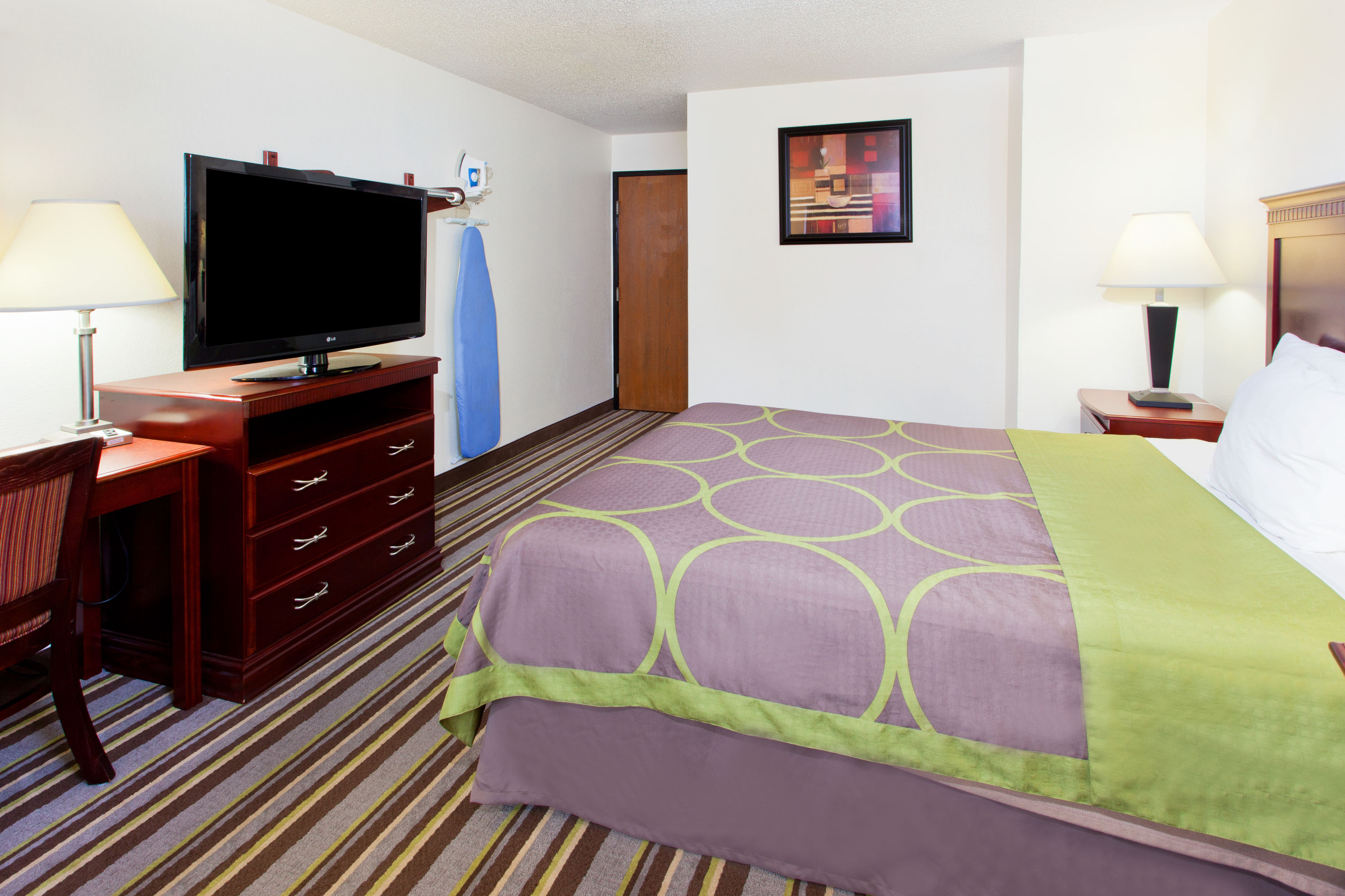 Guest room at the Super 8 by Wyndham Tuscaloosa in Tuscaloosa, Alabama