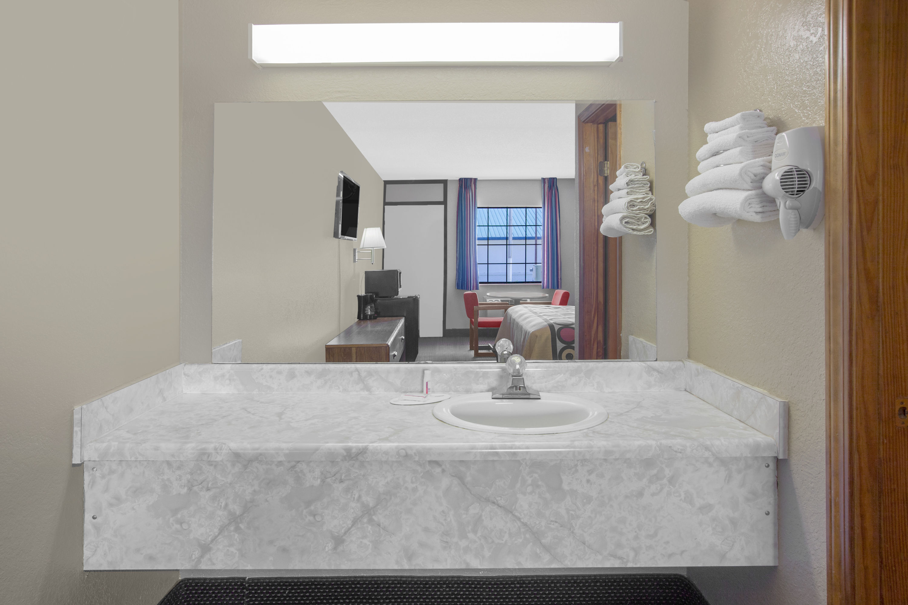 Guest room bath at the Super 8 by Wyndham Clarksville AR in Clarksville, Arkansas