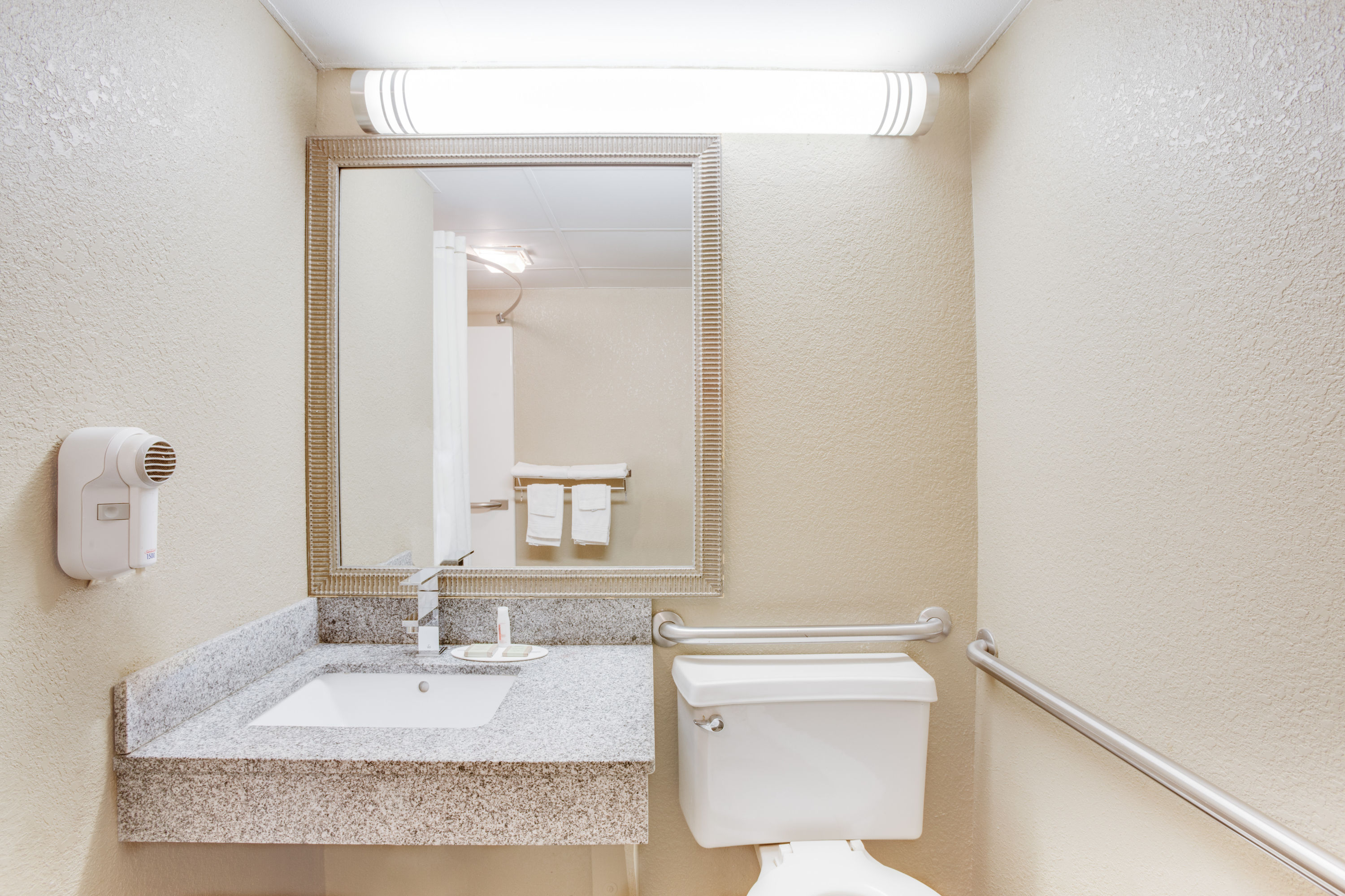Guest room bath at the Super 8 by Wyndham Morrilton in Morrilton, Arkansas