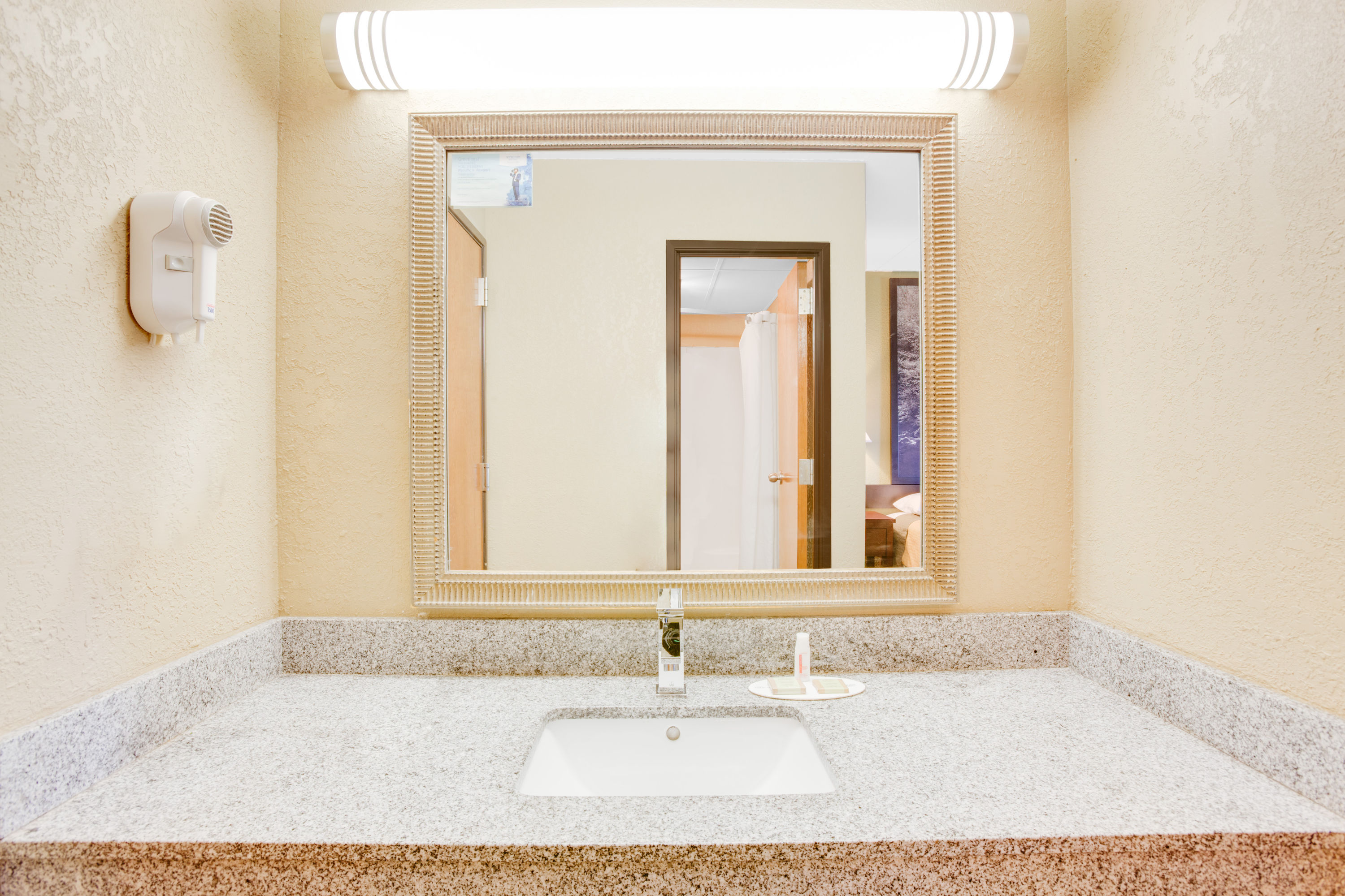 Guest room bath at the Super 8 by Wyndham Morrilton in Morrilton, Arkansas