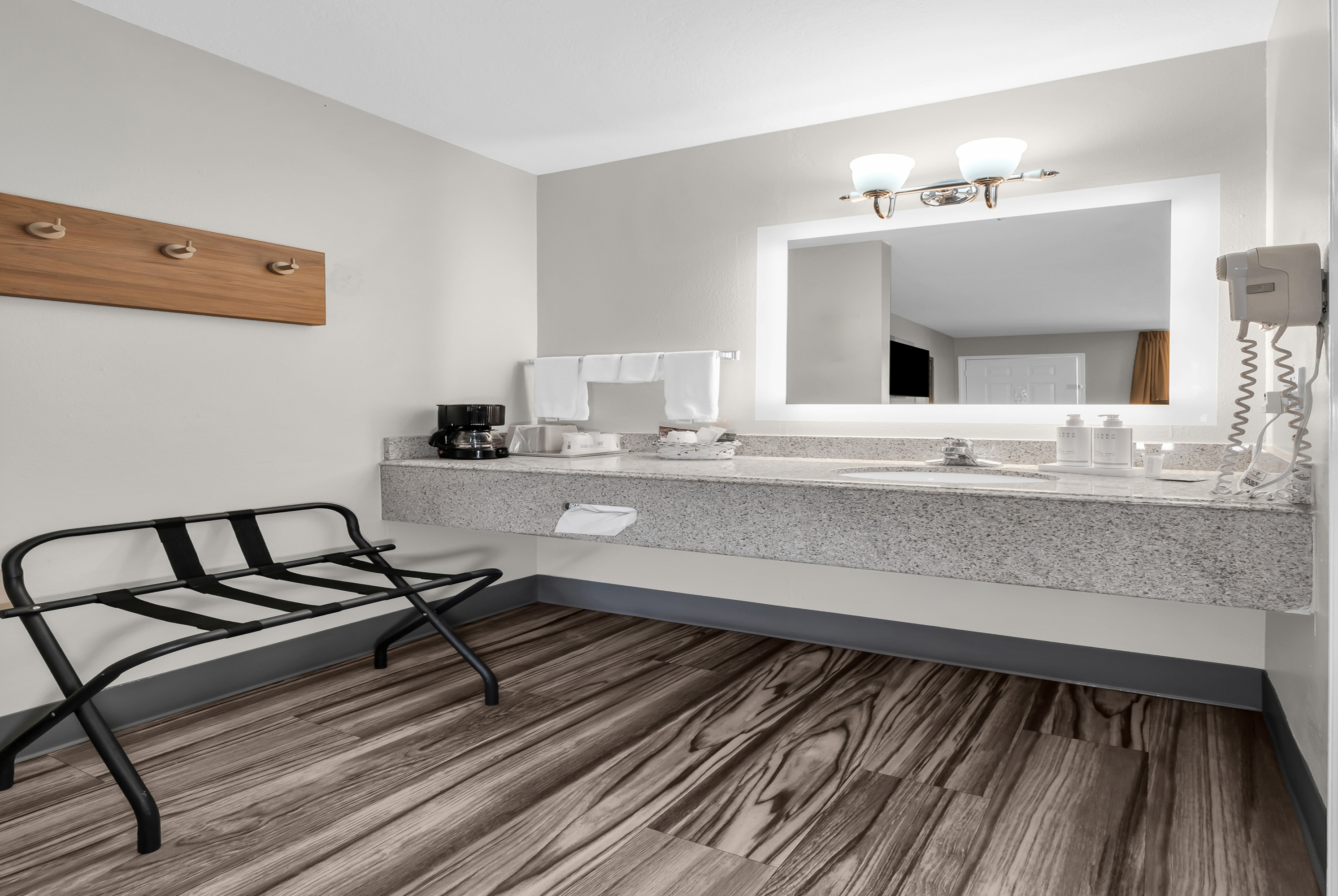 Guest room bath at the Super 8 by Wyndham Siloam Springs in Siloam Springs, Arkansas