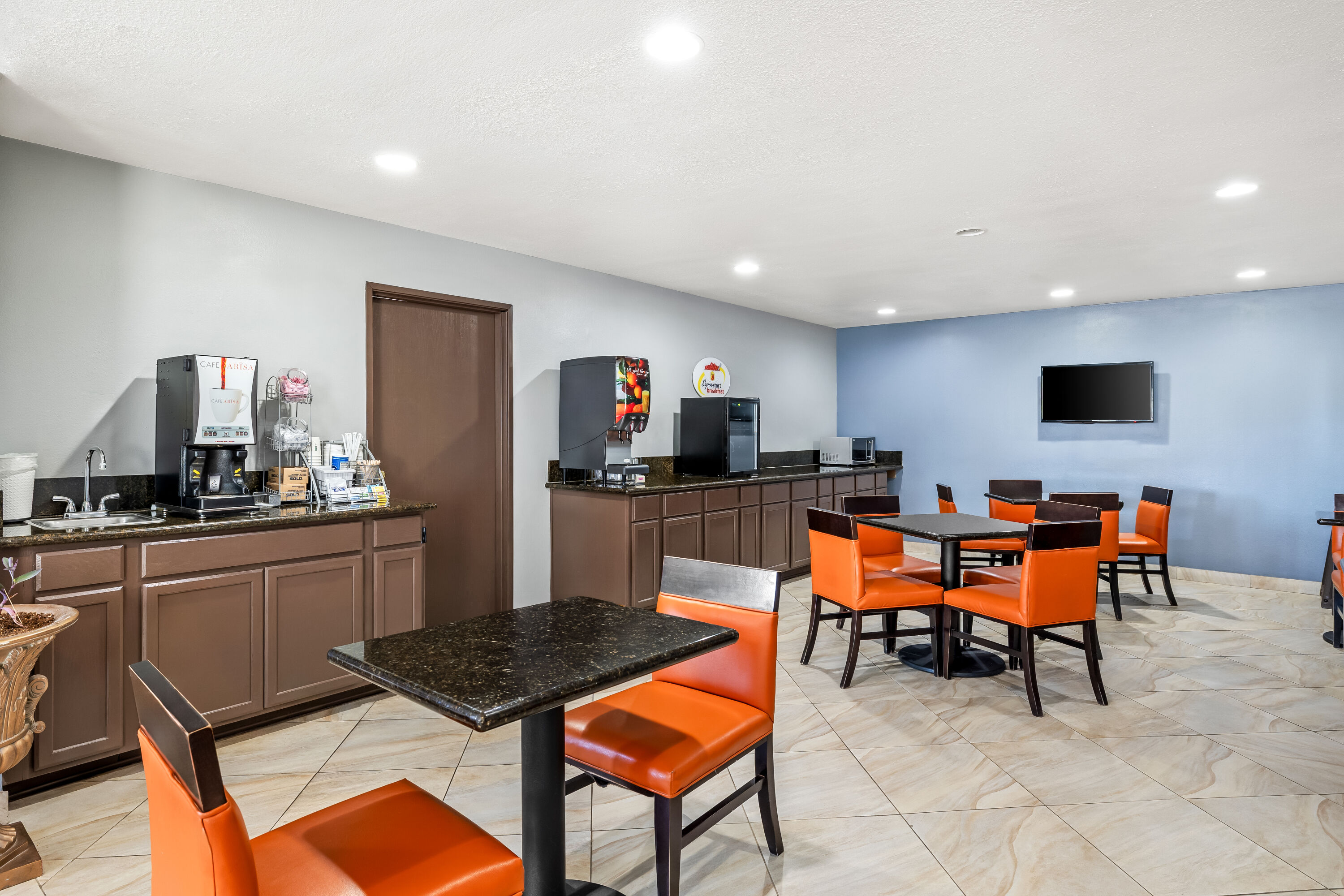 Super 8 by Wyndham Marana/Tucson Area restaurant breakfast area with seating in Marana, Arizona