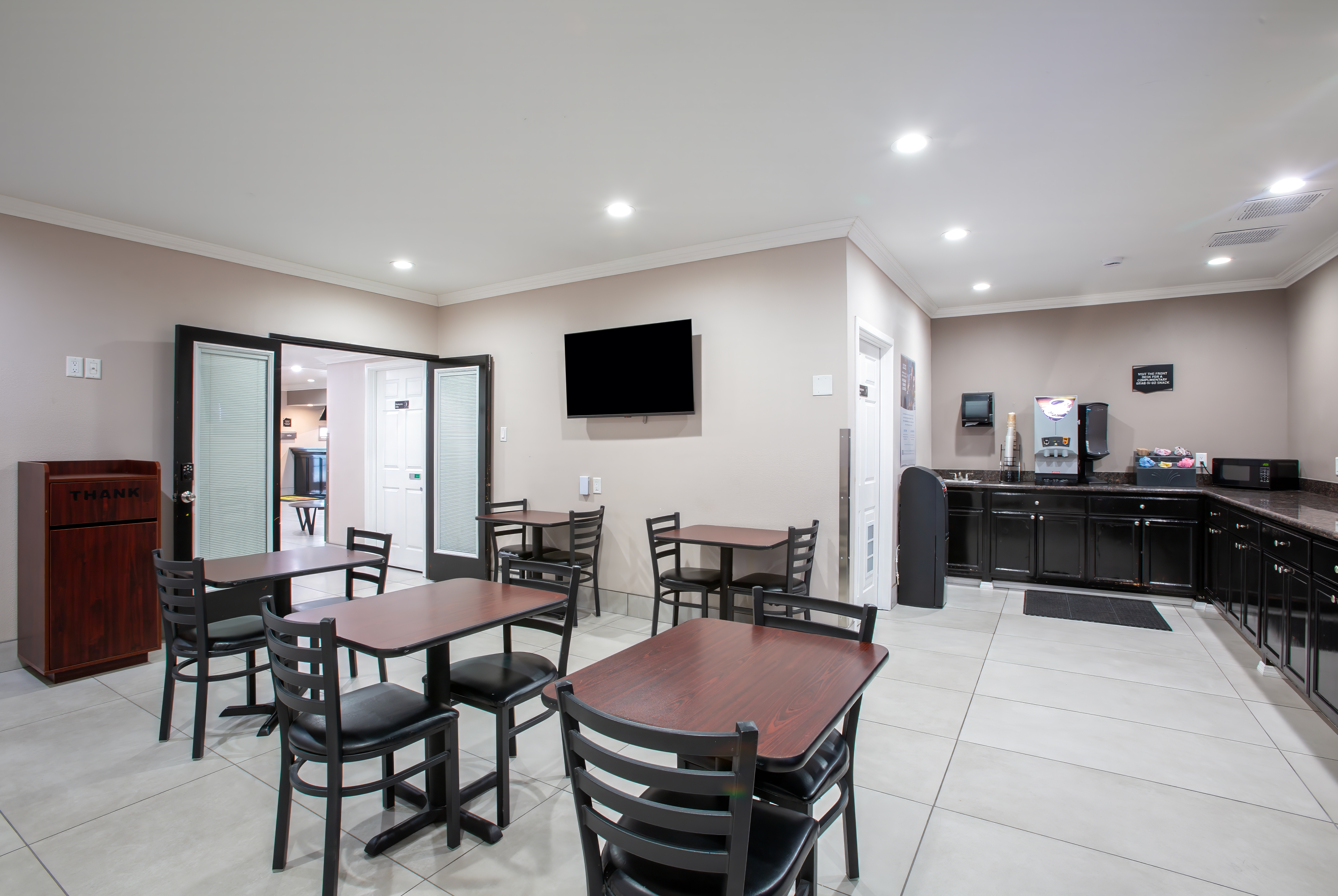 Super 8 by Wyndham Mesa Downtown Near Convention Center restaurant breakfast area with seating in Mesa, Arizona
